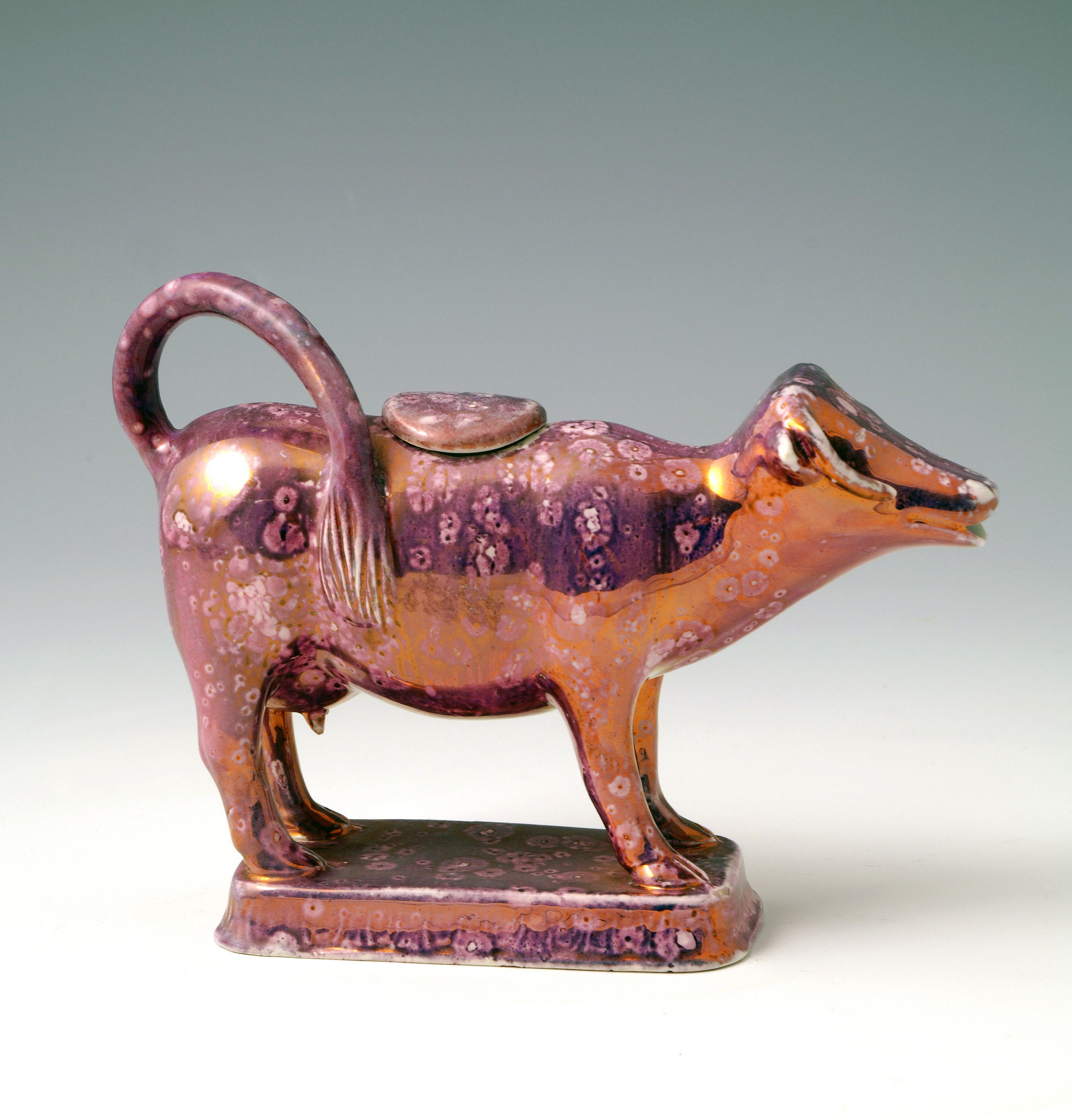 PINK LUSTER FIGURE OF A COW INTHE FORM OF A CREAMER C1815