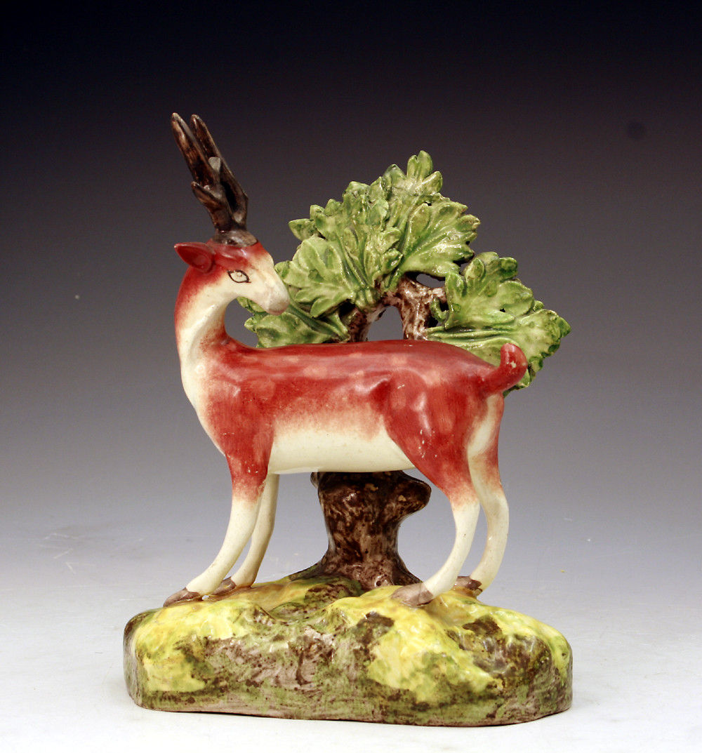 Staffordshire pottery figure of a stag with bocage circa 1820