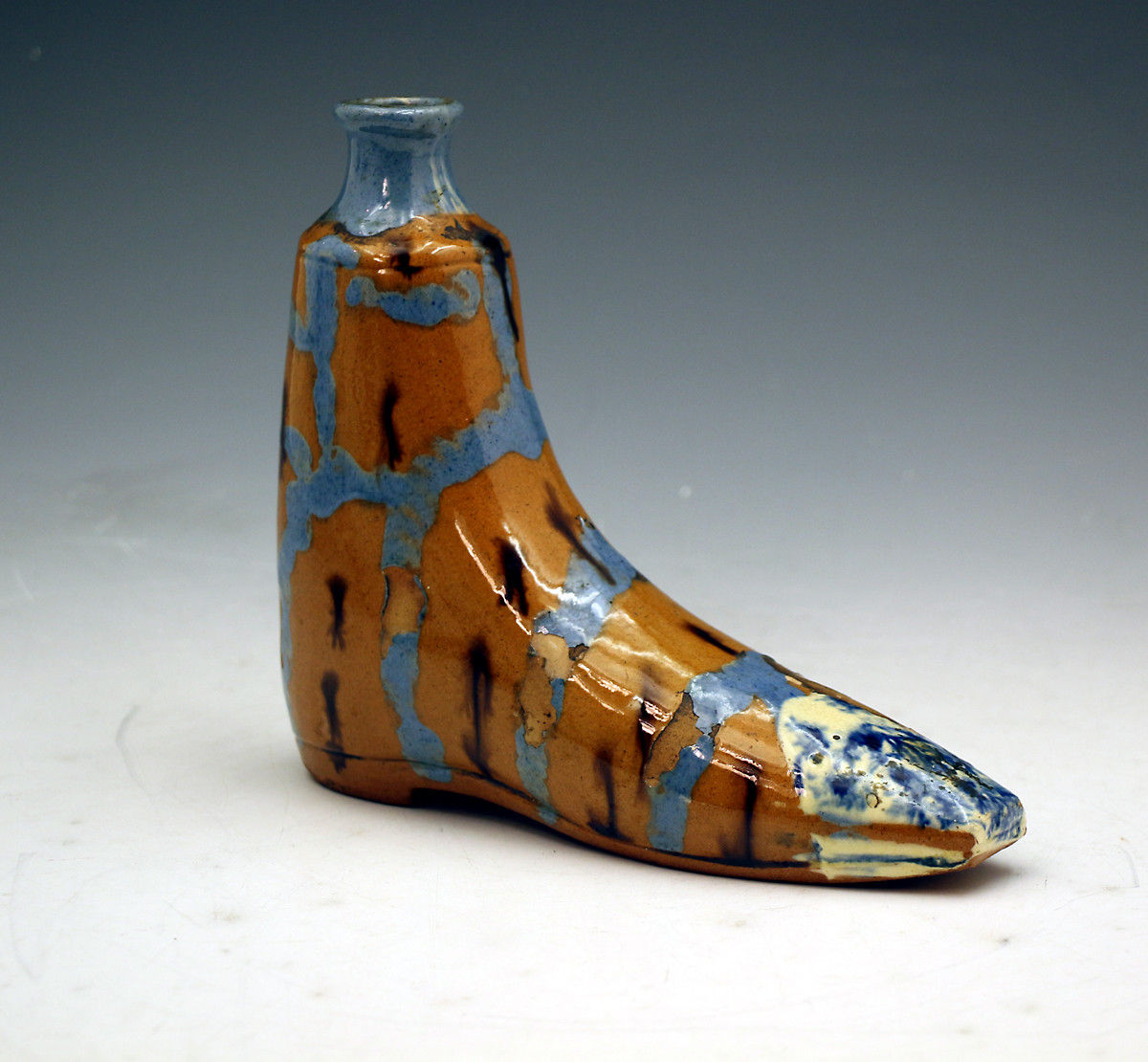 Antique pottery gin flask with slip and mocha decoration mid 19th century