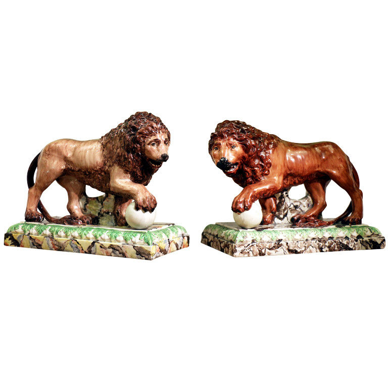 Pair  of antique English pottery lions on bases Staffordshire Pottery circa 1820