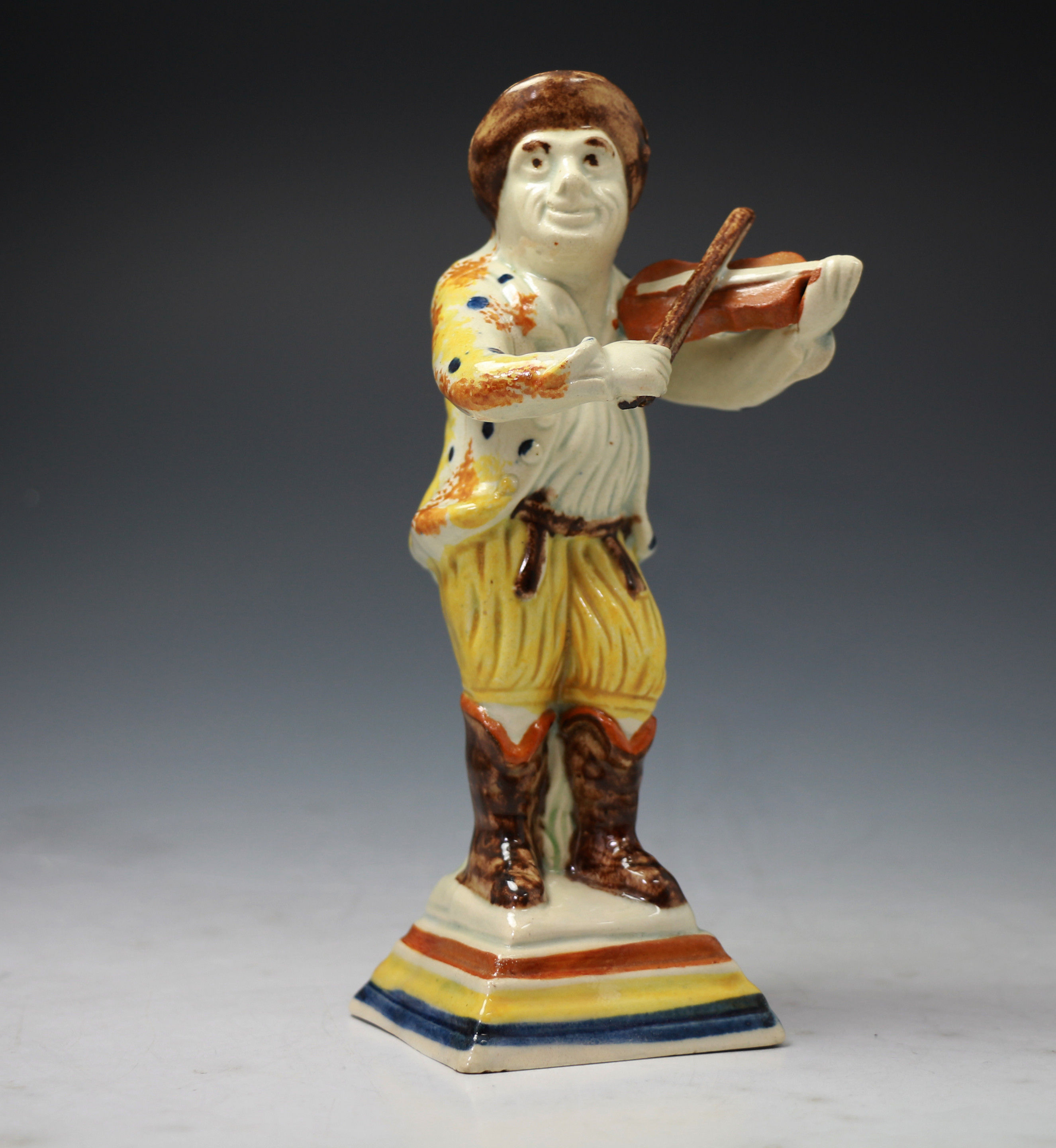 Antique English pottery prattware figure of a fiddler c1800