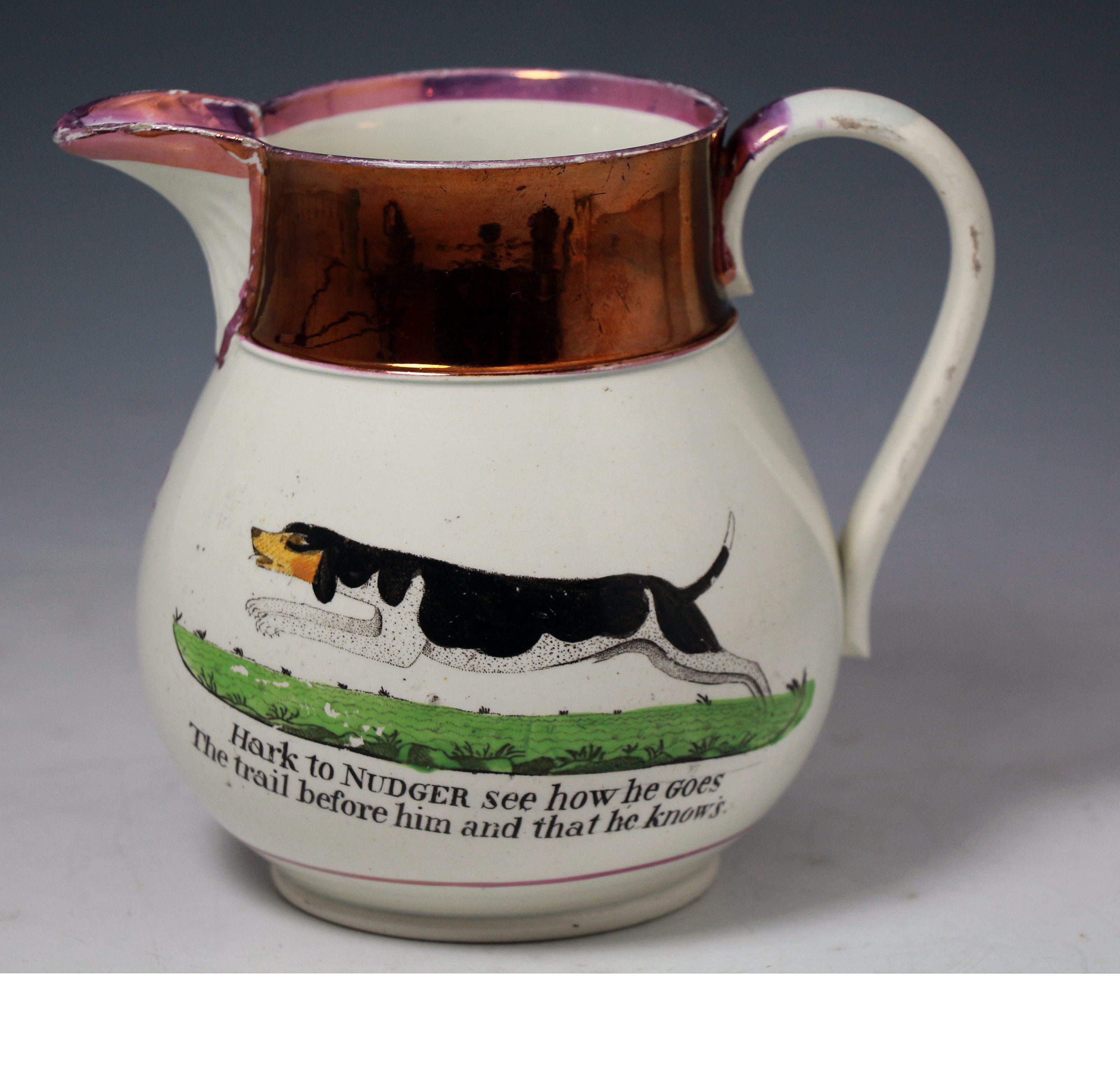 Antique Staffordshire pottery luster decorated pitcher with the dog named Nudger.