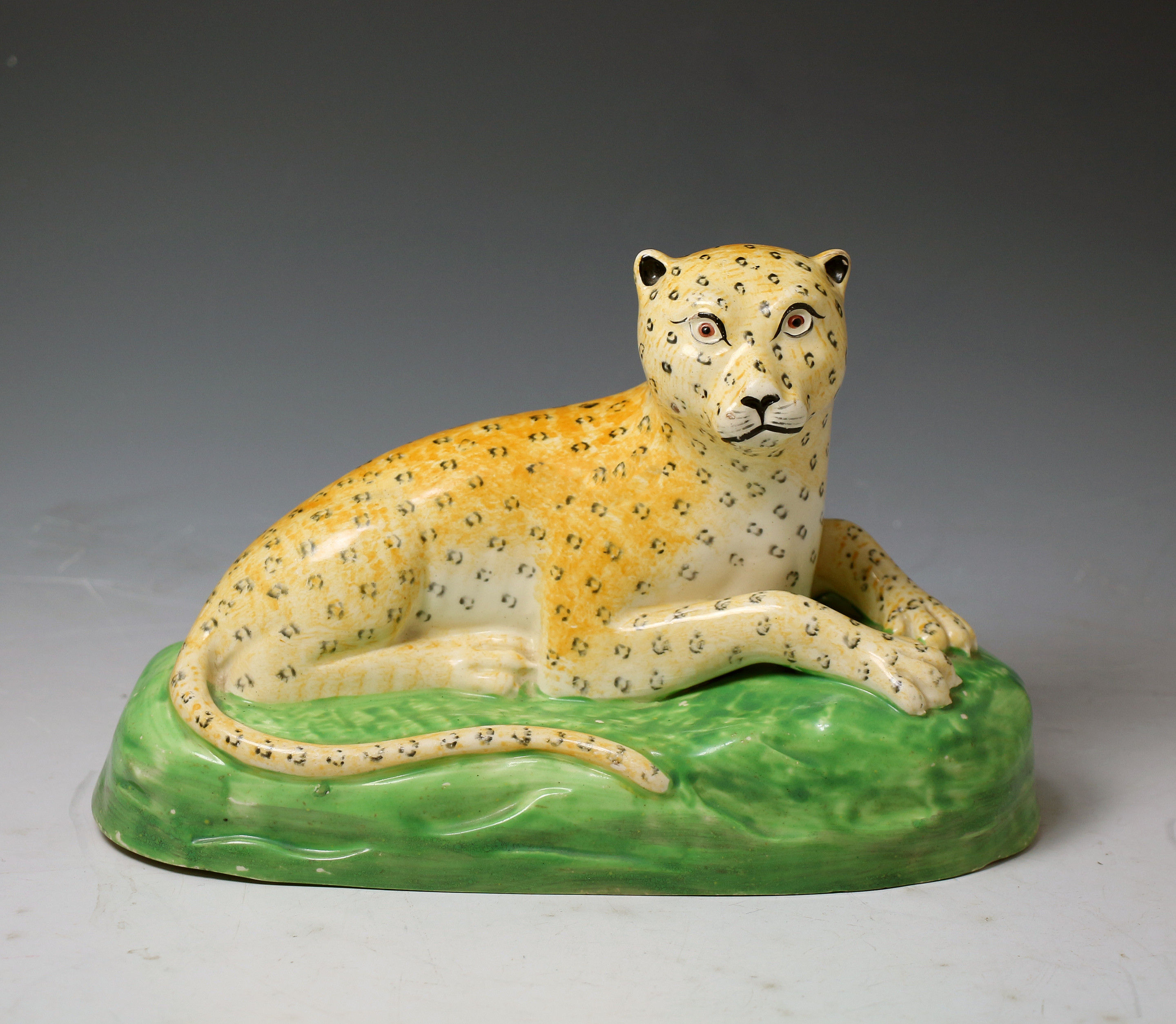 English antique earthenware  Creamware pottery figure of a leopard, Staffordshire c1800  