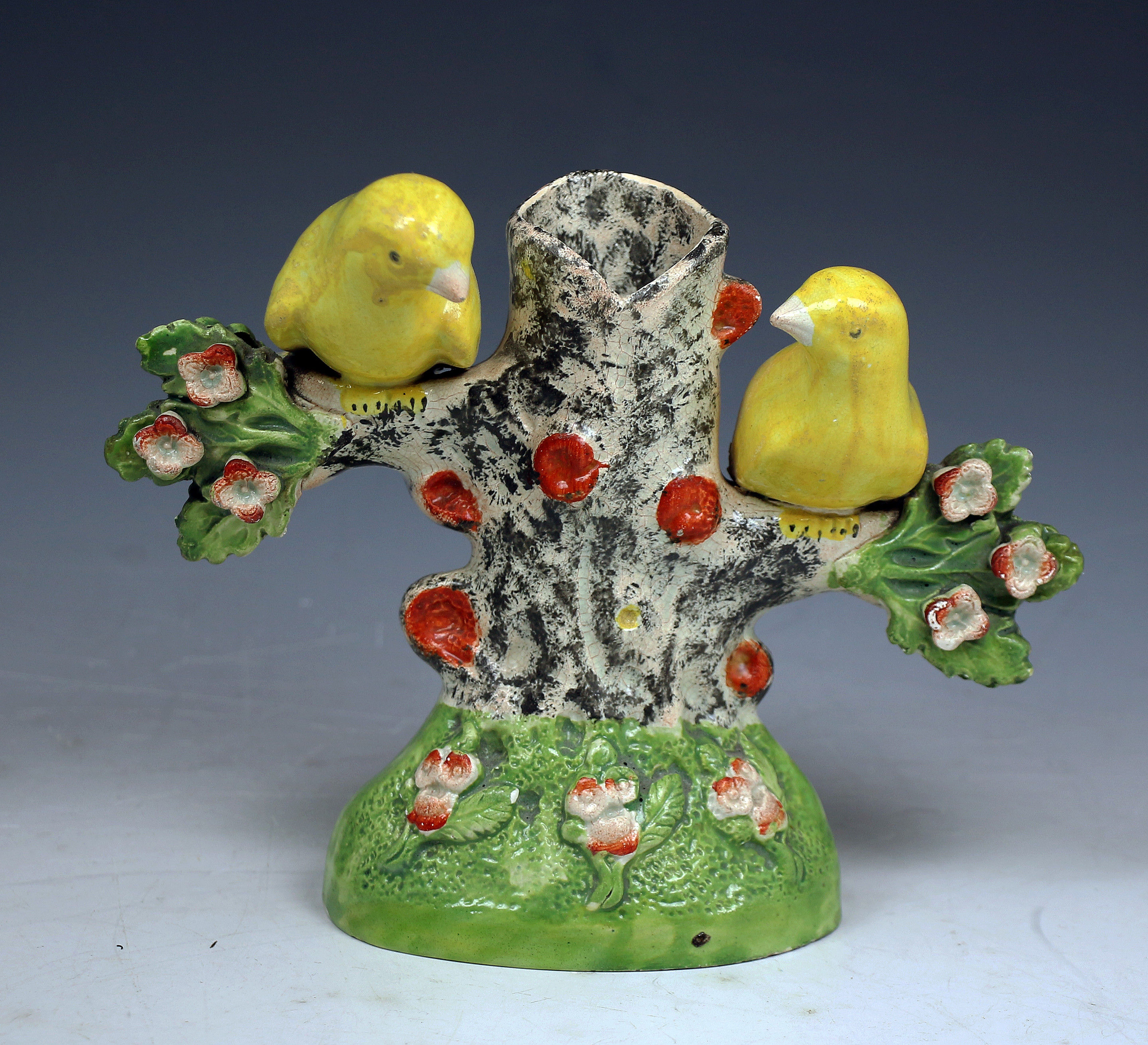 Pair of Staffordshire pottery birds in branches from  the Obadiah Sherratt Pottery