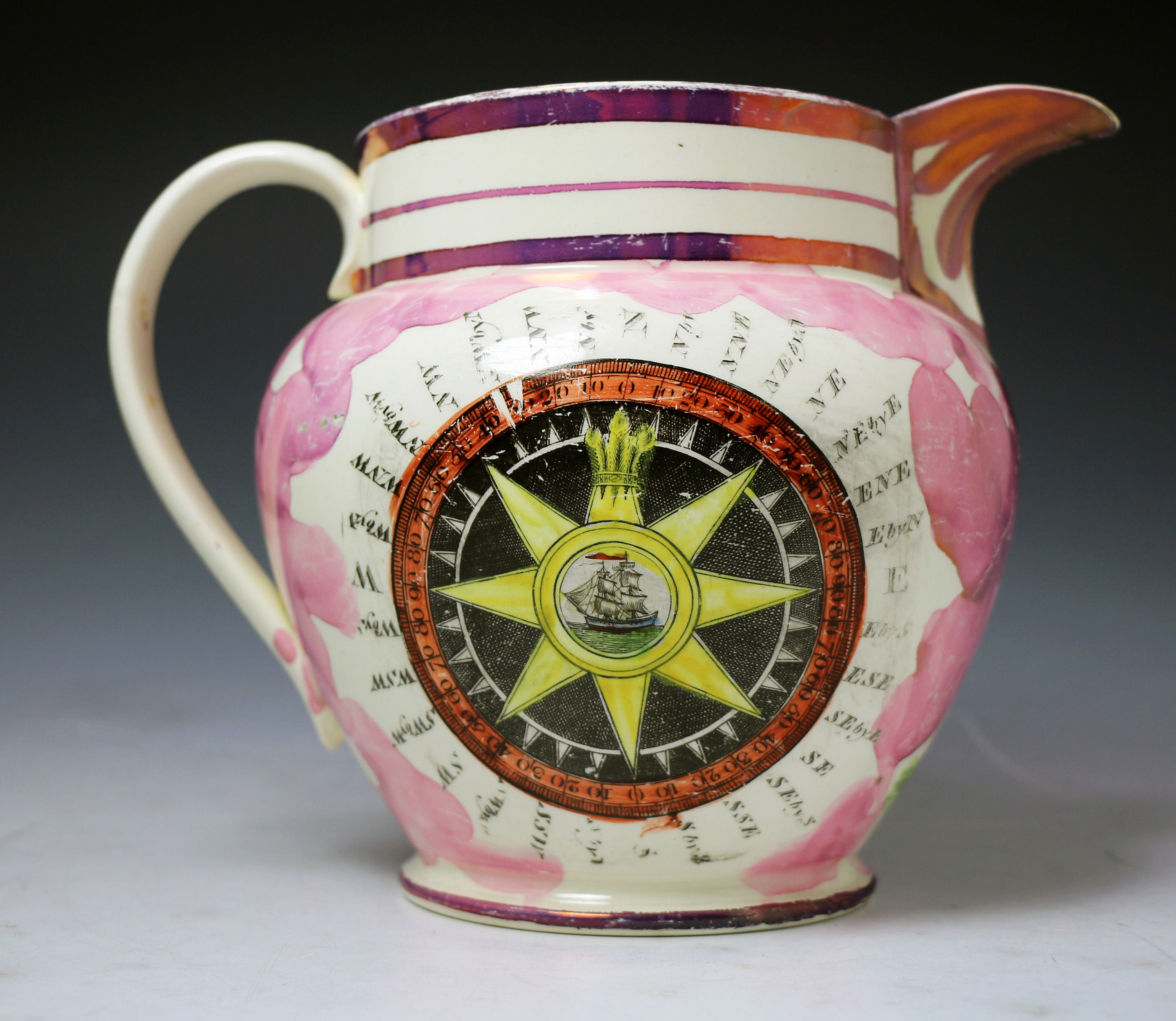 Antique pink luster pottery pitcher with nautical related decorations c1820