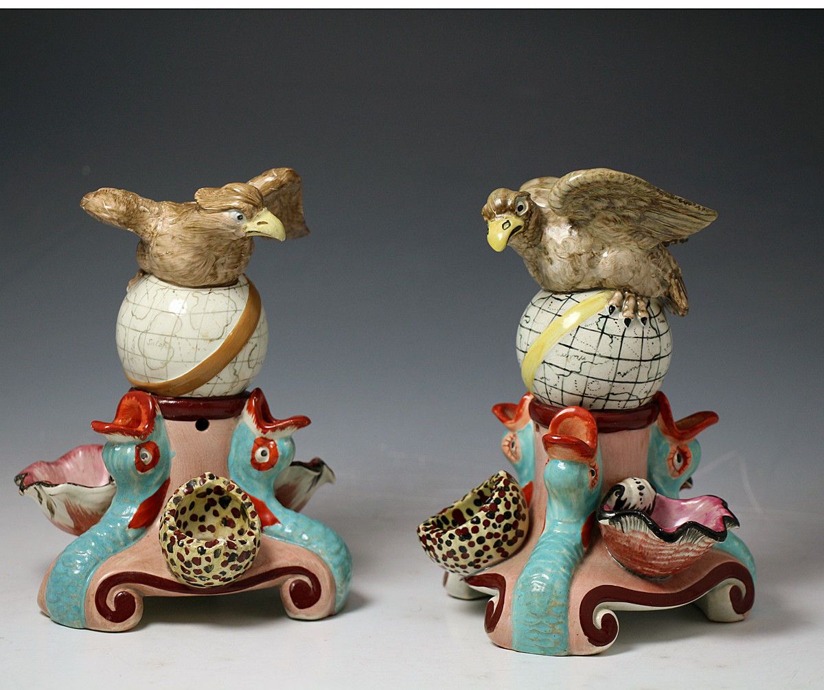 Antique Staffordshire pottery pearlware figures of Eagles and Dolphins.