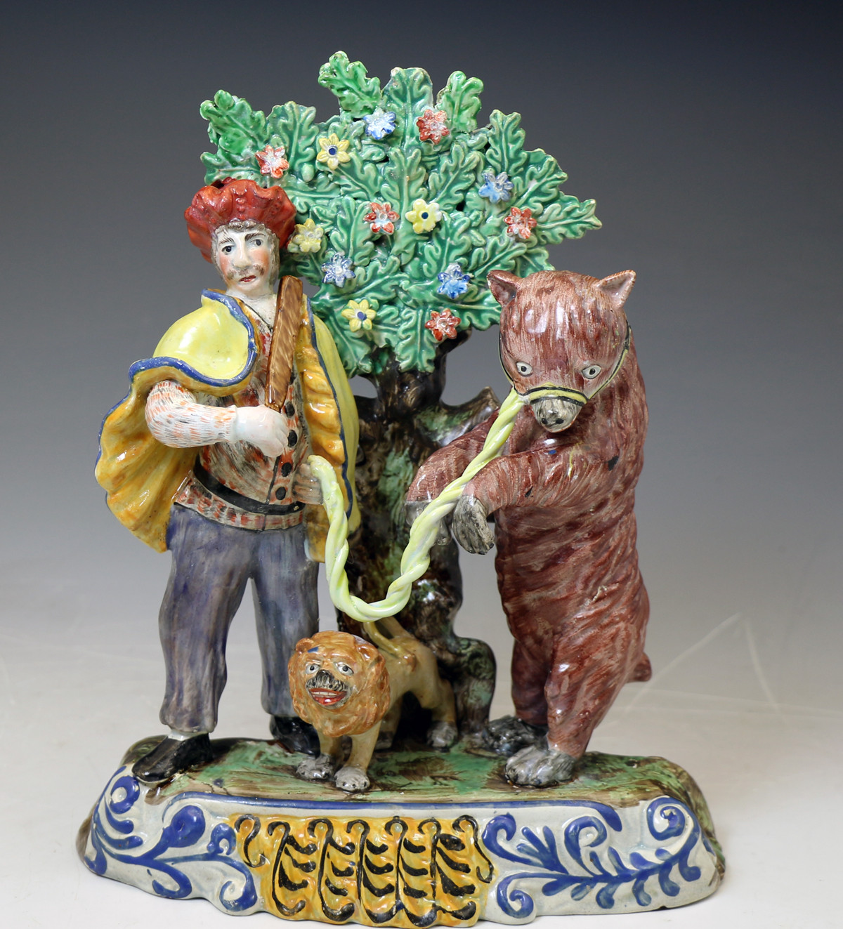 Antique Staffordshire  pottery figure of a Dancing Bear group with bocage c1820