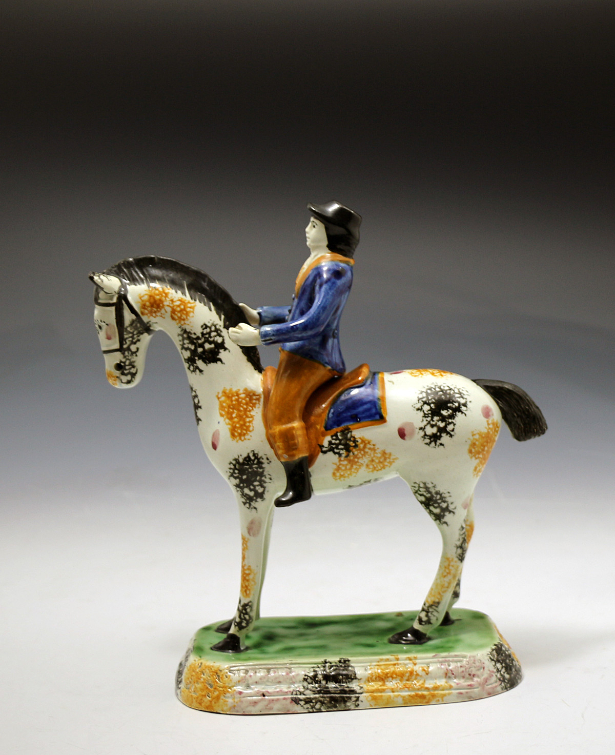 Antique English Yorkshire pottery figure of a  horse and rider in Pratt colors c1810