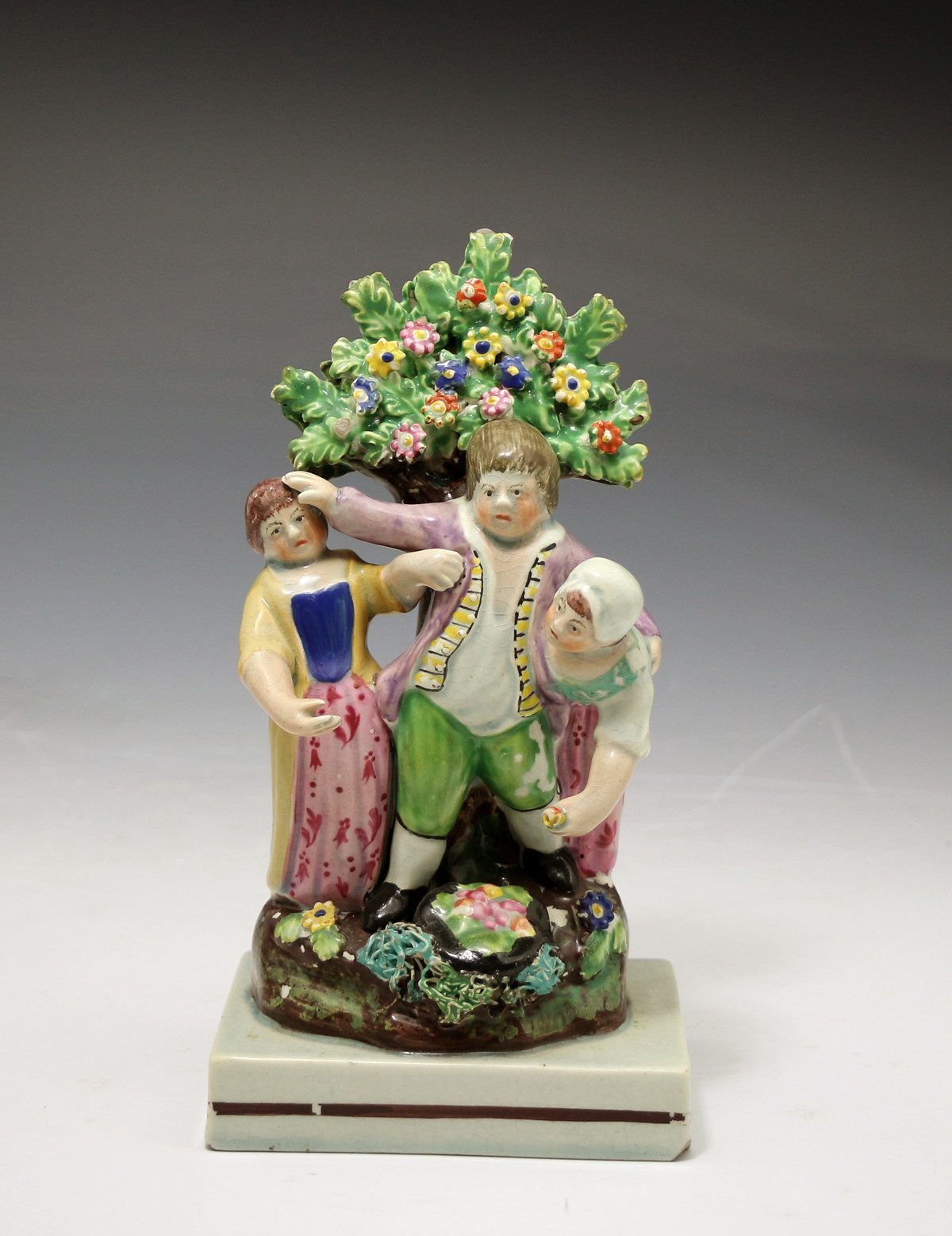 Antique Staffordshire pottery figure with bocage 
