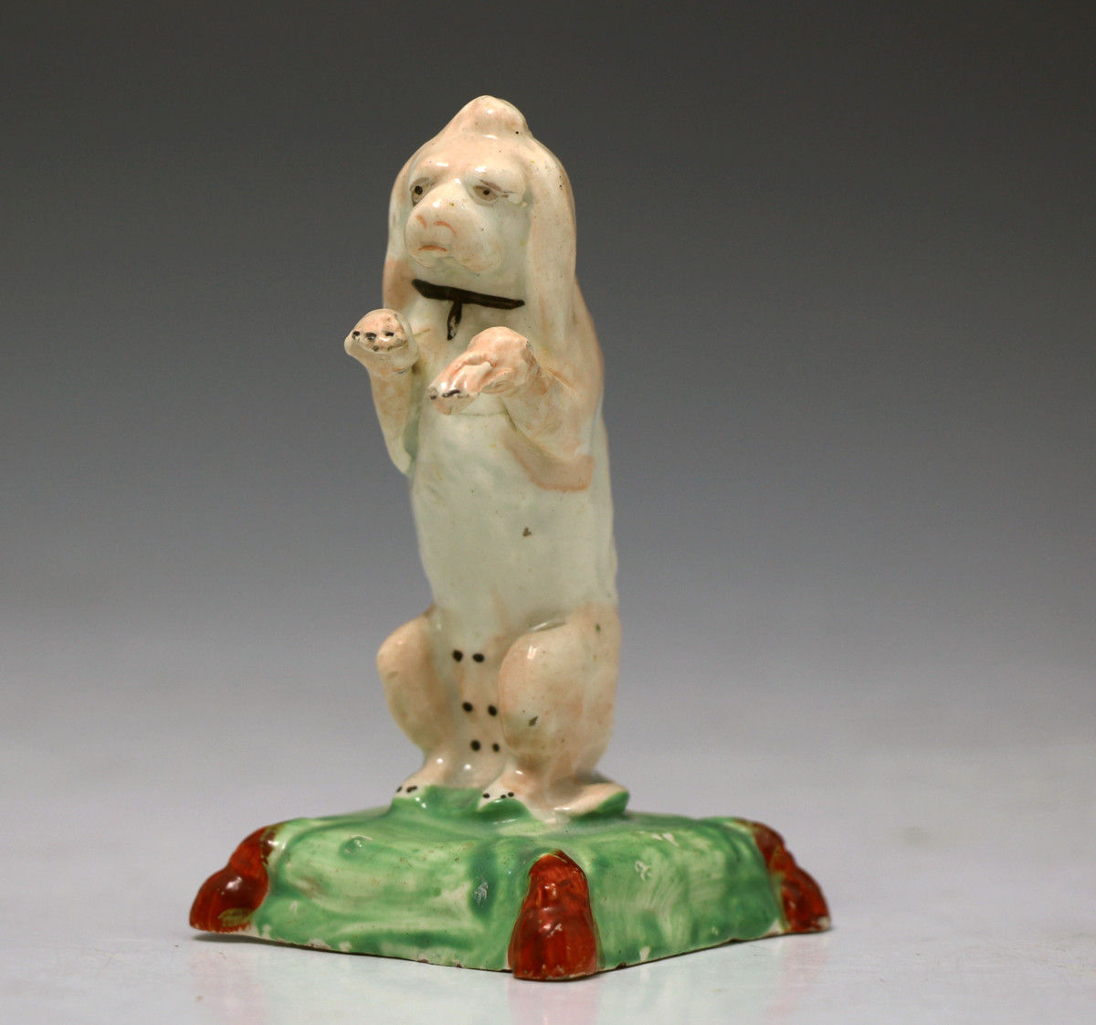 ANTIQUE STAFFORDSHIRE POTTERY FIGURE OF A BEGGING DOG EARLY 19TH CENTURY