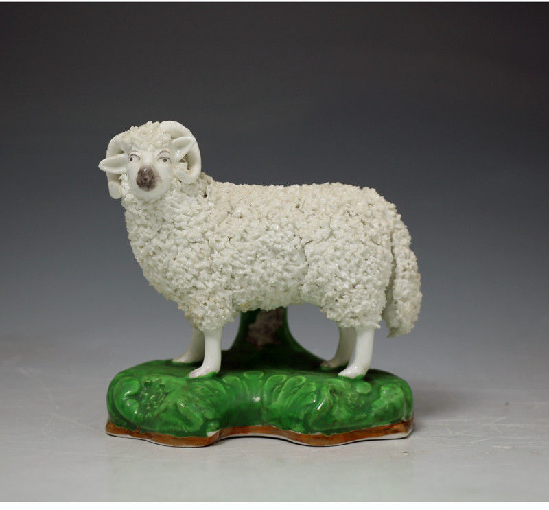 Antique Staffordshire figure of a seated ram early Victorian period