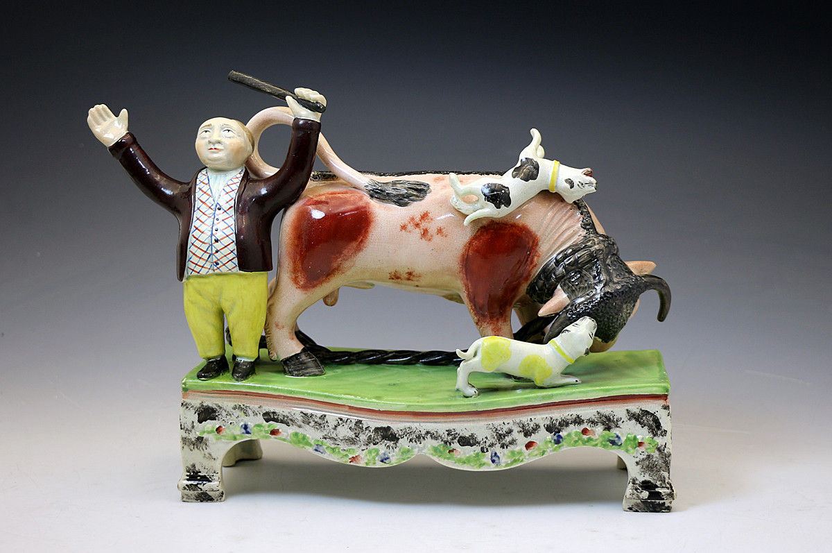 Antique Staffordshire figure of a bull baiting group on a table base by Obadiah Sherratt c1820