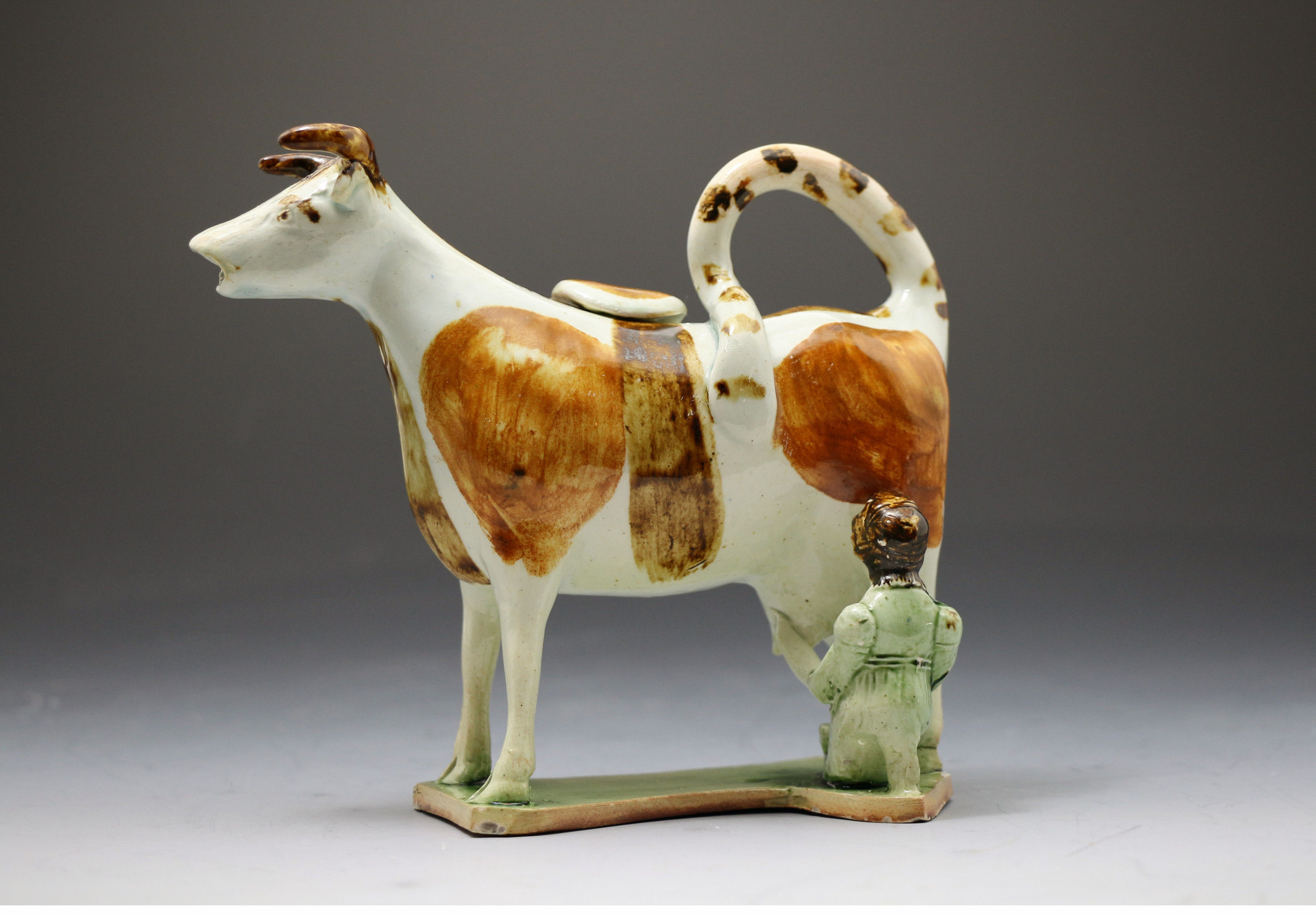 Antique period pottery creamer figure in the form of a cow, Yorkshire pottery circa 1800