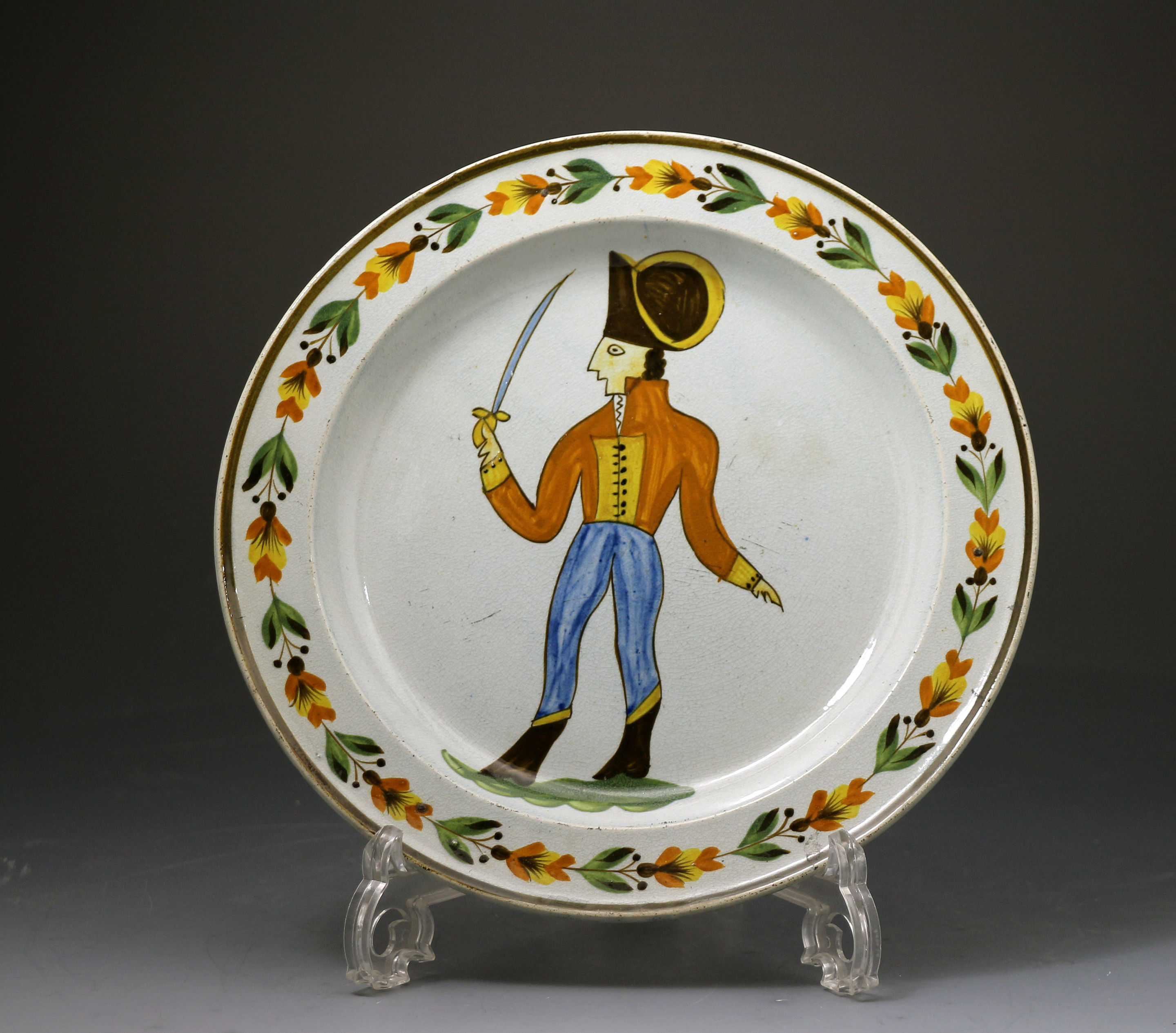 Antique English pottery Prattware plate with figure of a soldier c1795