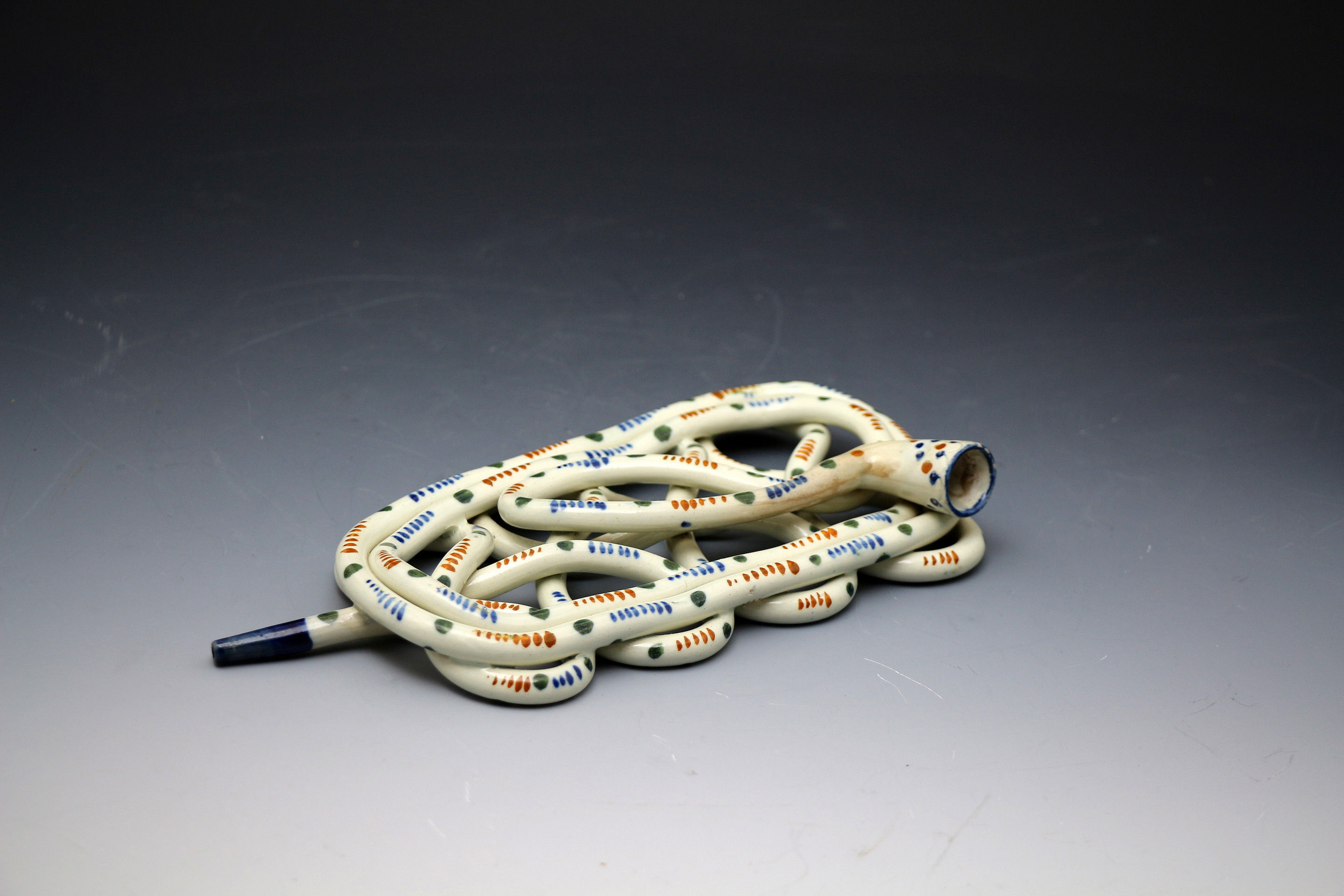 Antique English pottery smokers coil pipe in Pratt colurs, probably Staffordshire circa 1810