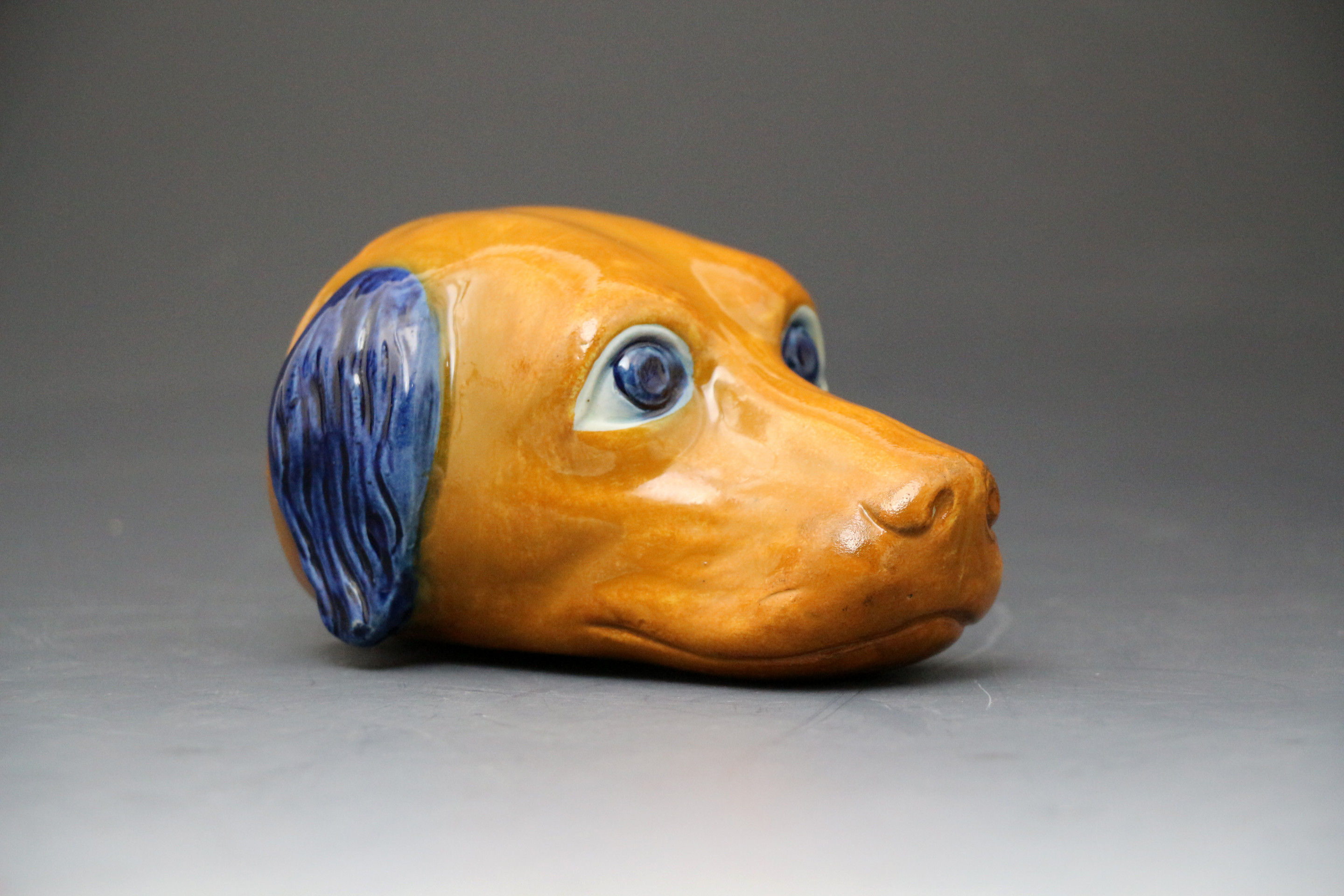 Antique English pottery prattware figure of hounds head in the form of a stirrup cup.