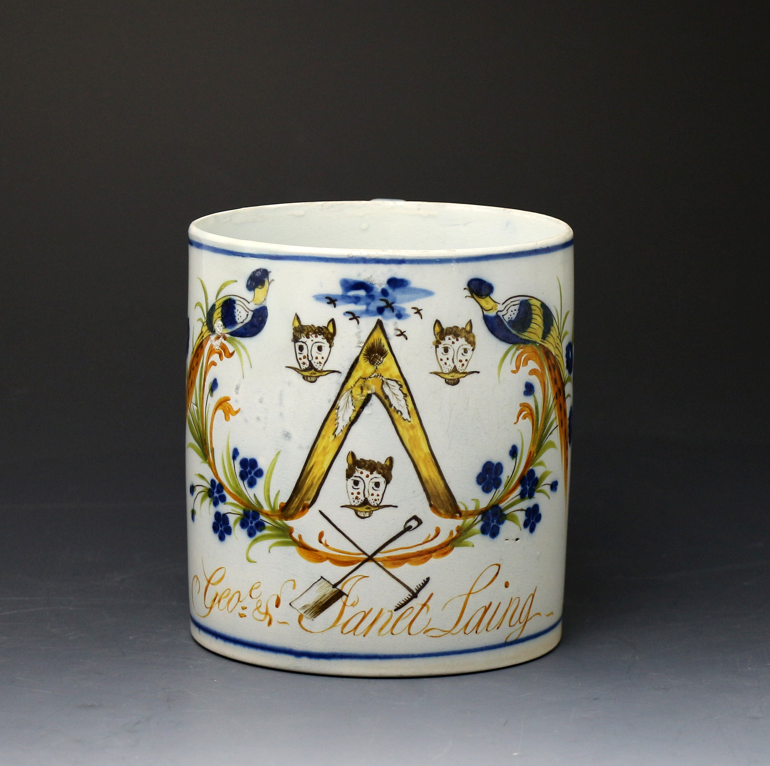 Antique English pottery Prattware tankard with peafowl named and with coat of arms.