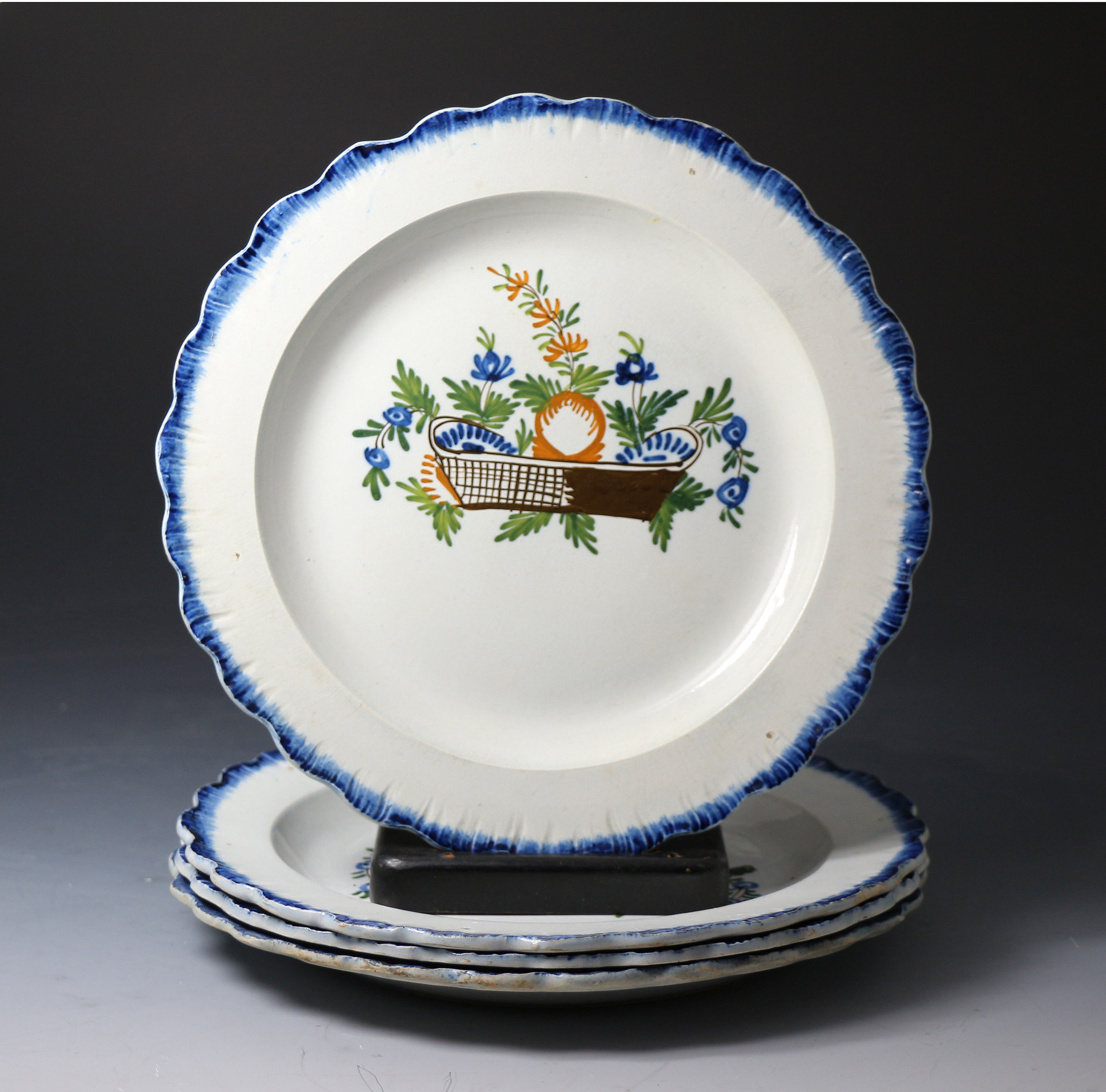 Set of four Antique English pottery pearlware plates with pratt color decoration with baskets of flowers.c1810