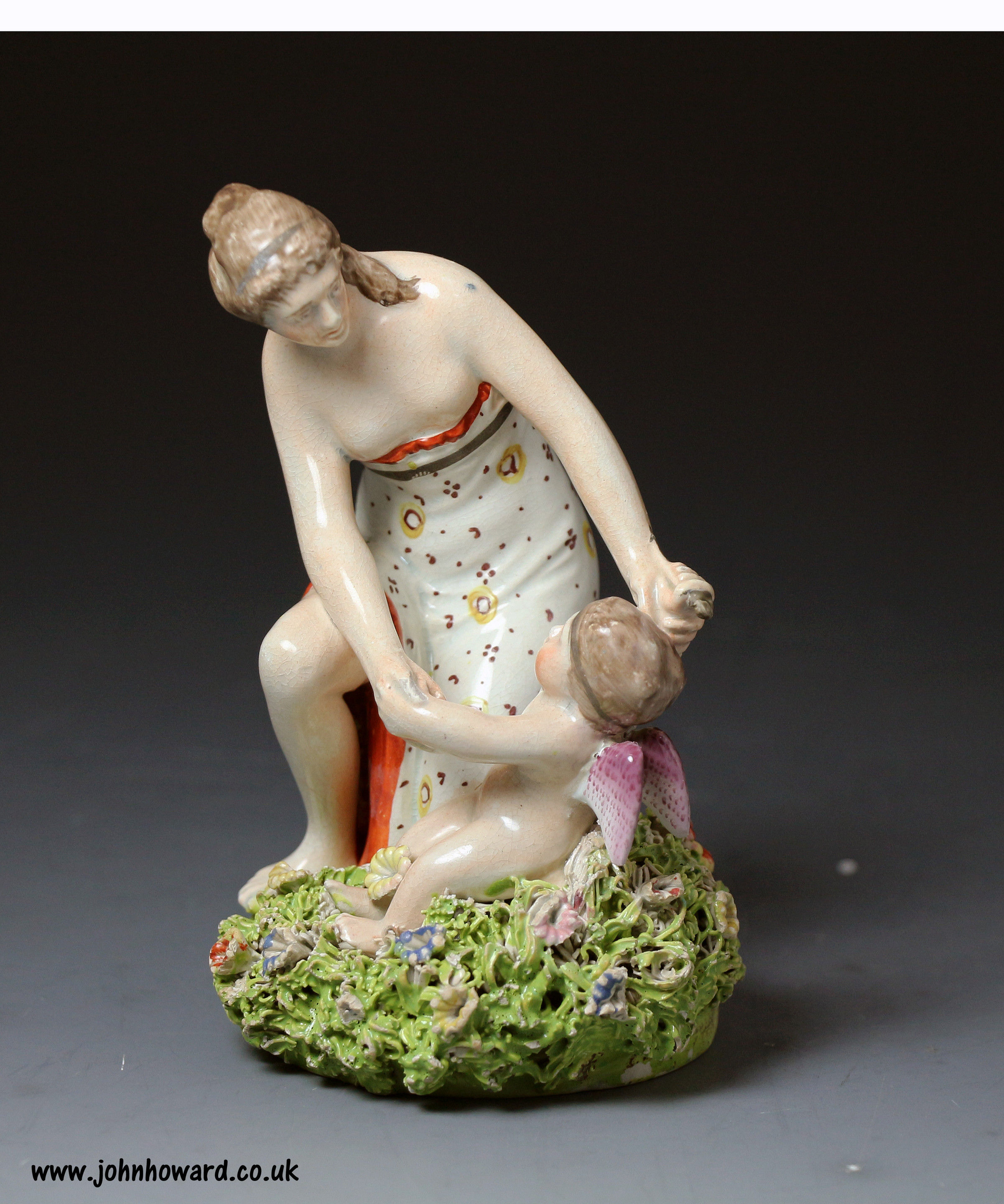 Antique Staffordshire pottery pearlware figure of Venus and cupid early 19th century period.