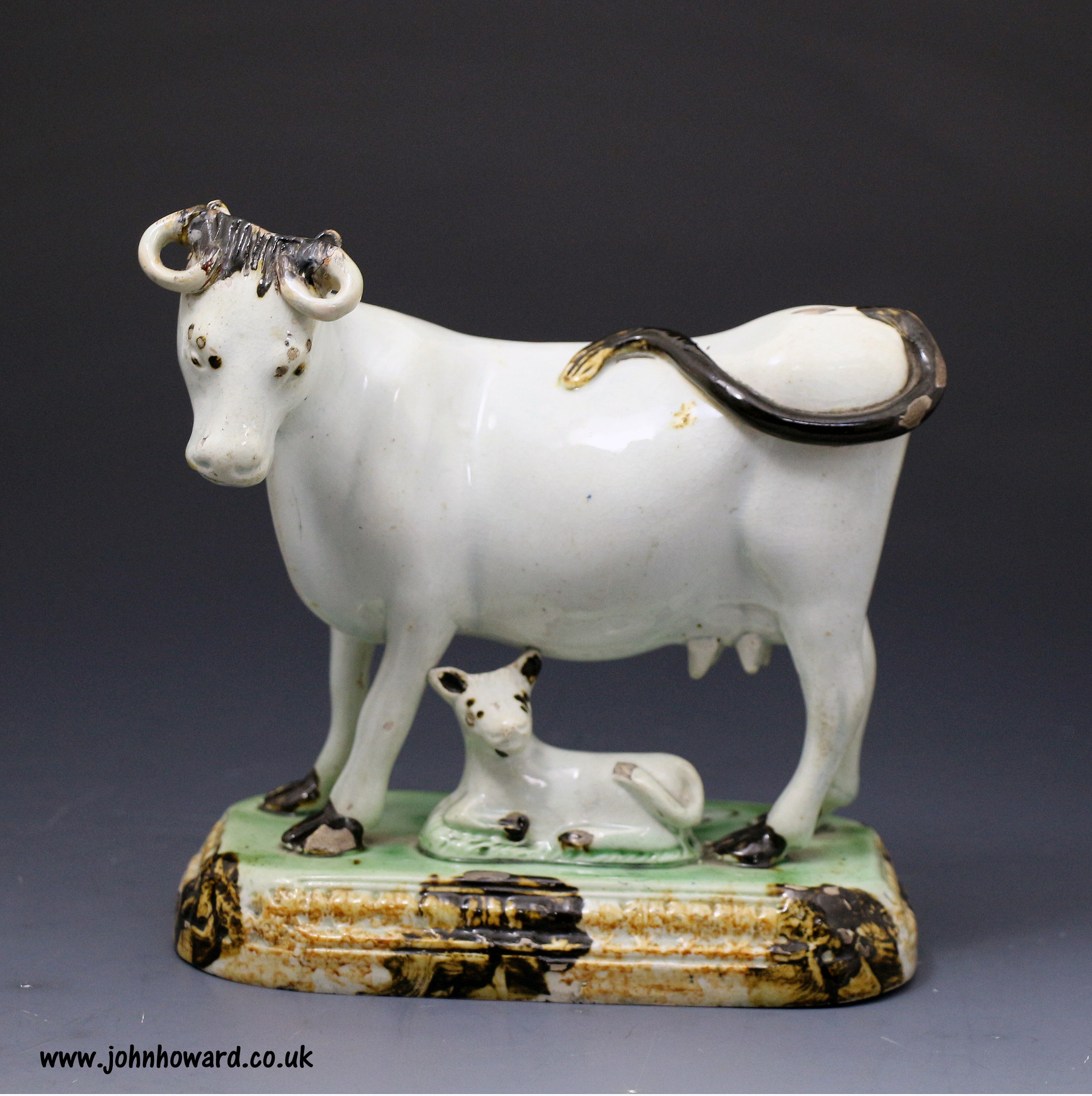 Antique English pottery figure of a cow named 