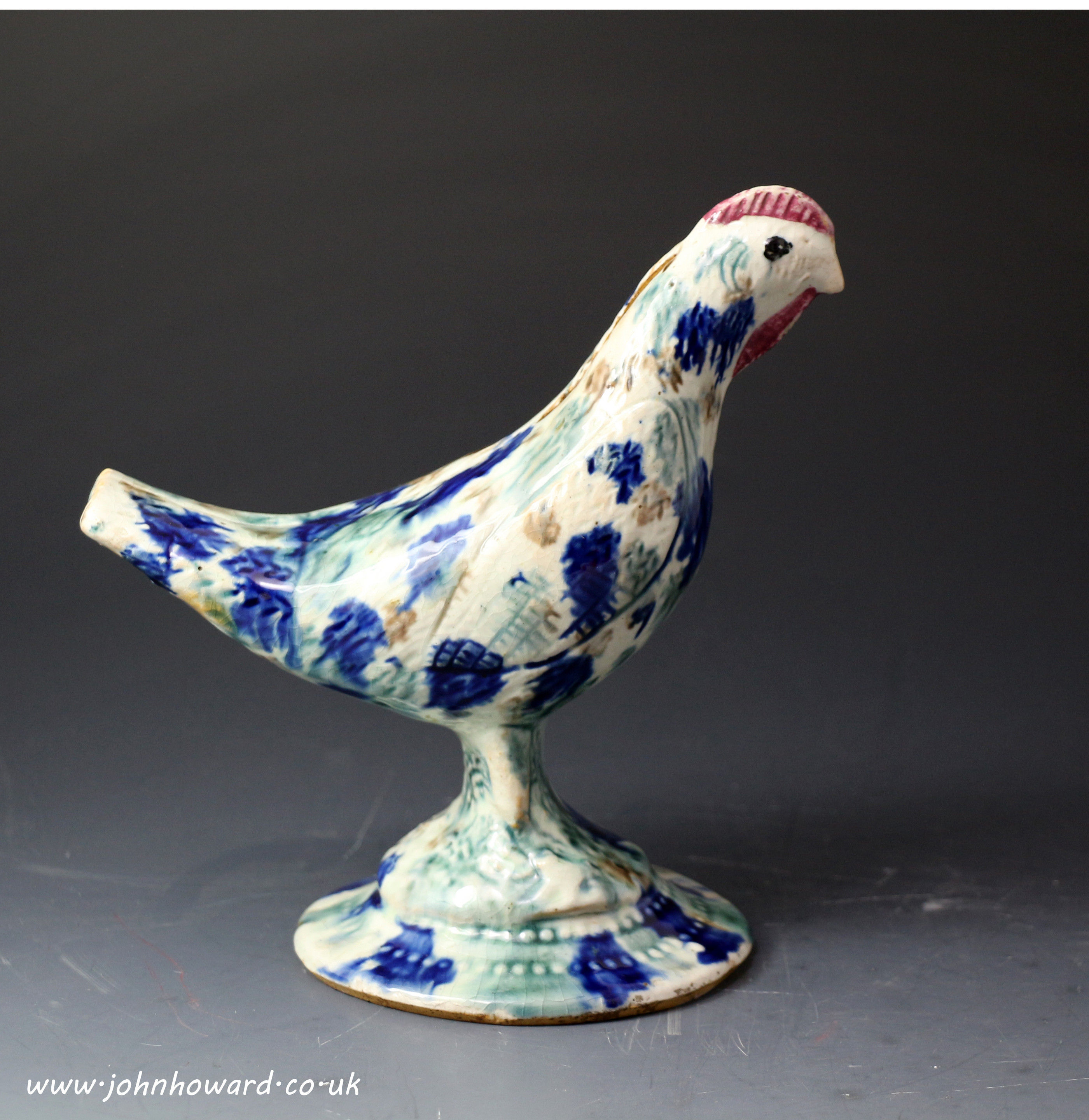 Antique Scottish pottery figure of a bird in the form of a money bank. 