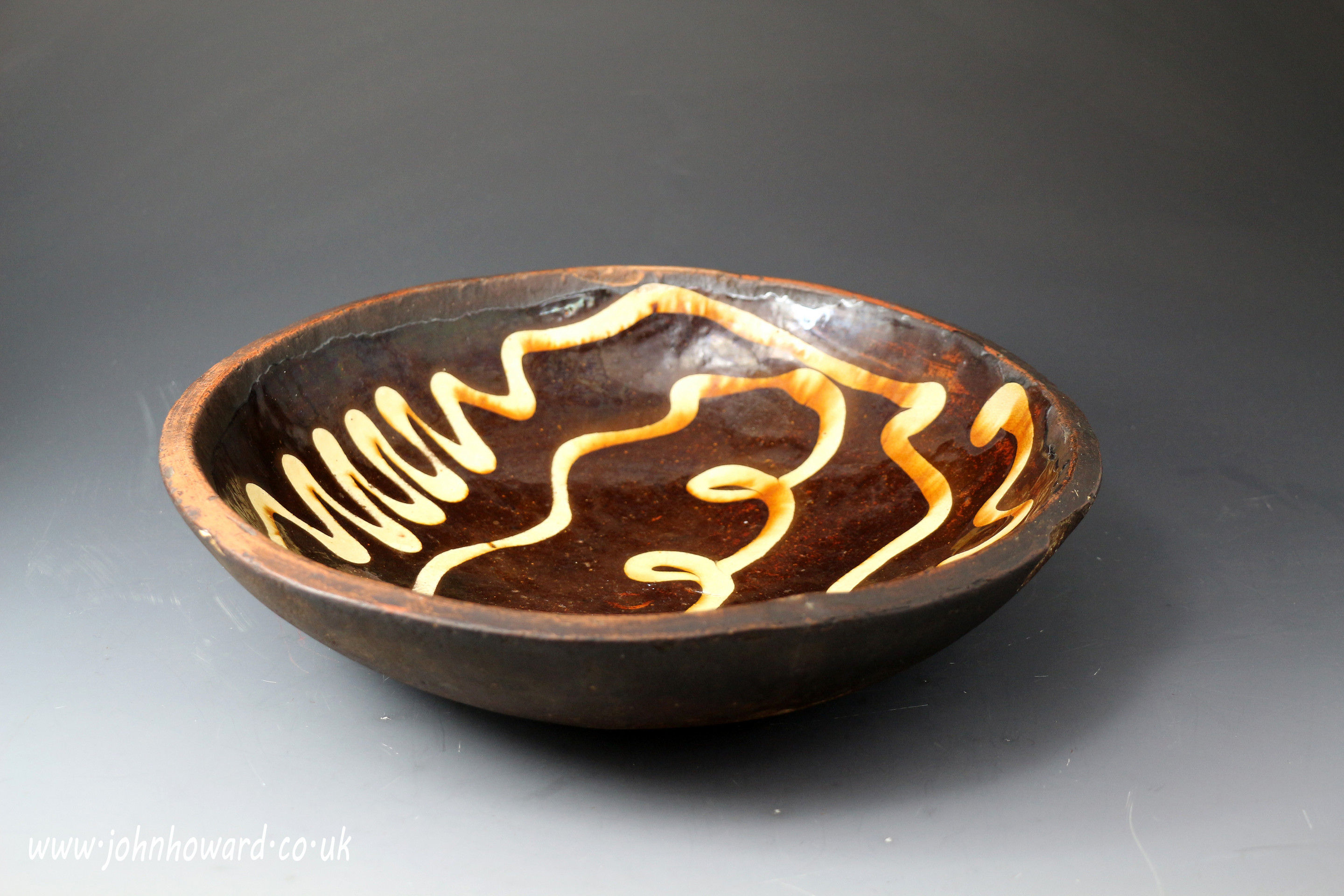 18th century antique earthenware slipware circular dish English pottery.