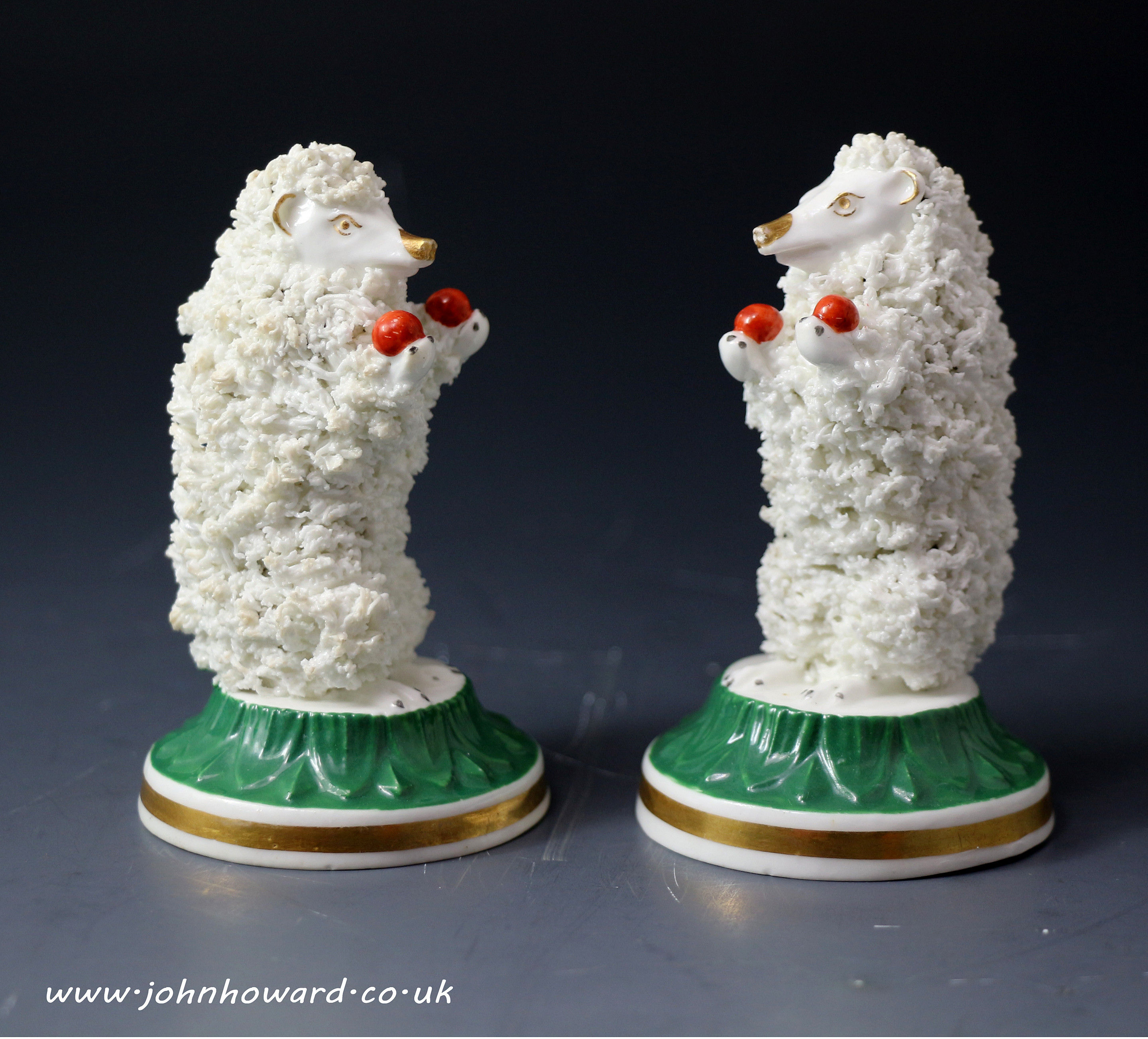 Antique English porcelain pair of figures of Juggling Hedgehogs c1820