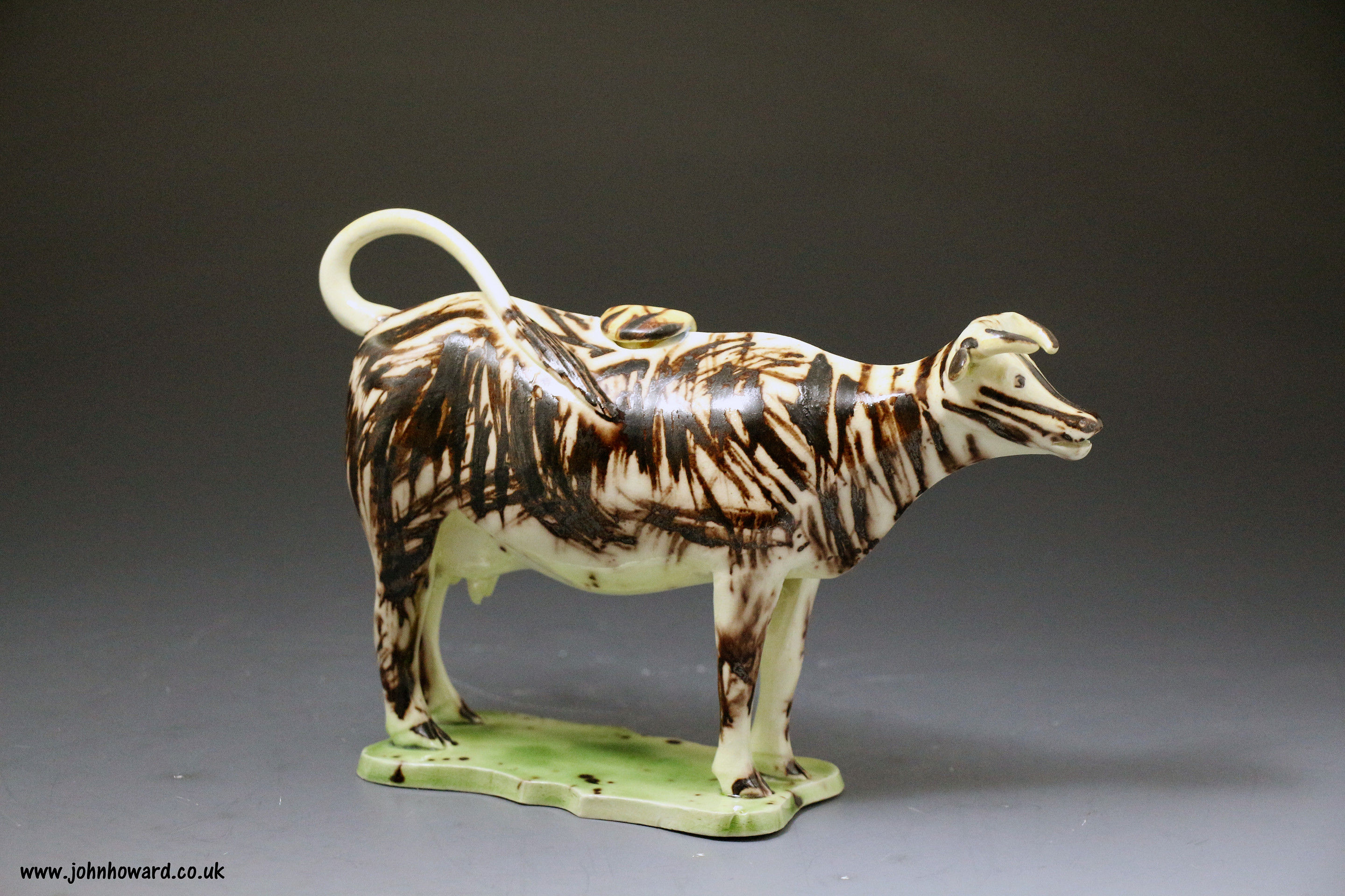 Antique English pottery figure of a cow creamer ,late 18th century