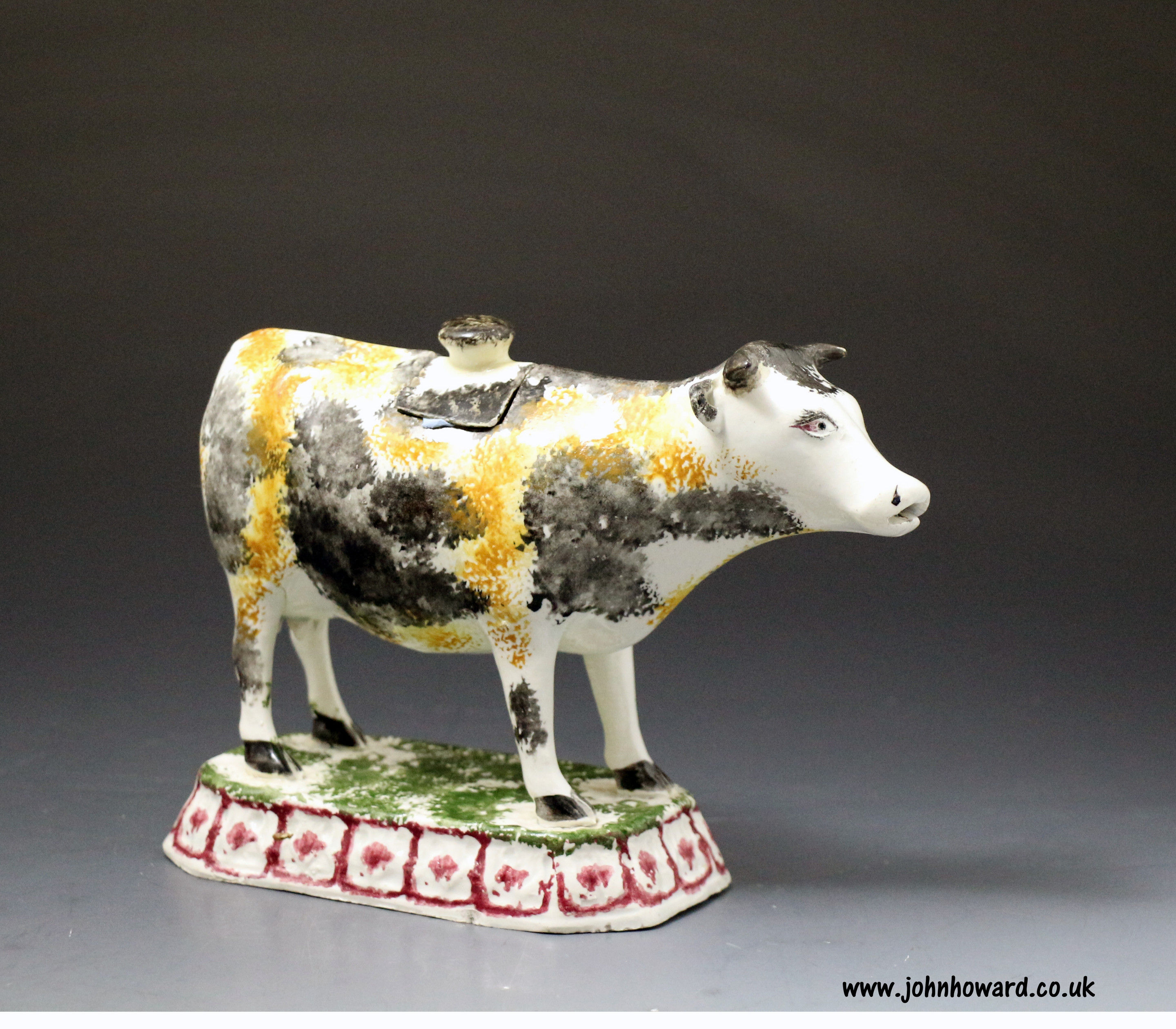 Antique British pottery figure of a cow in the form of a creamer. Early 19th century
