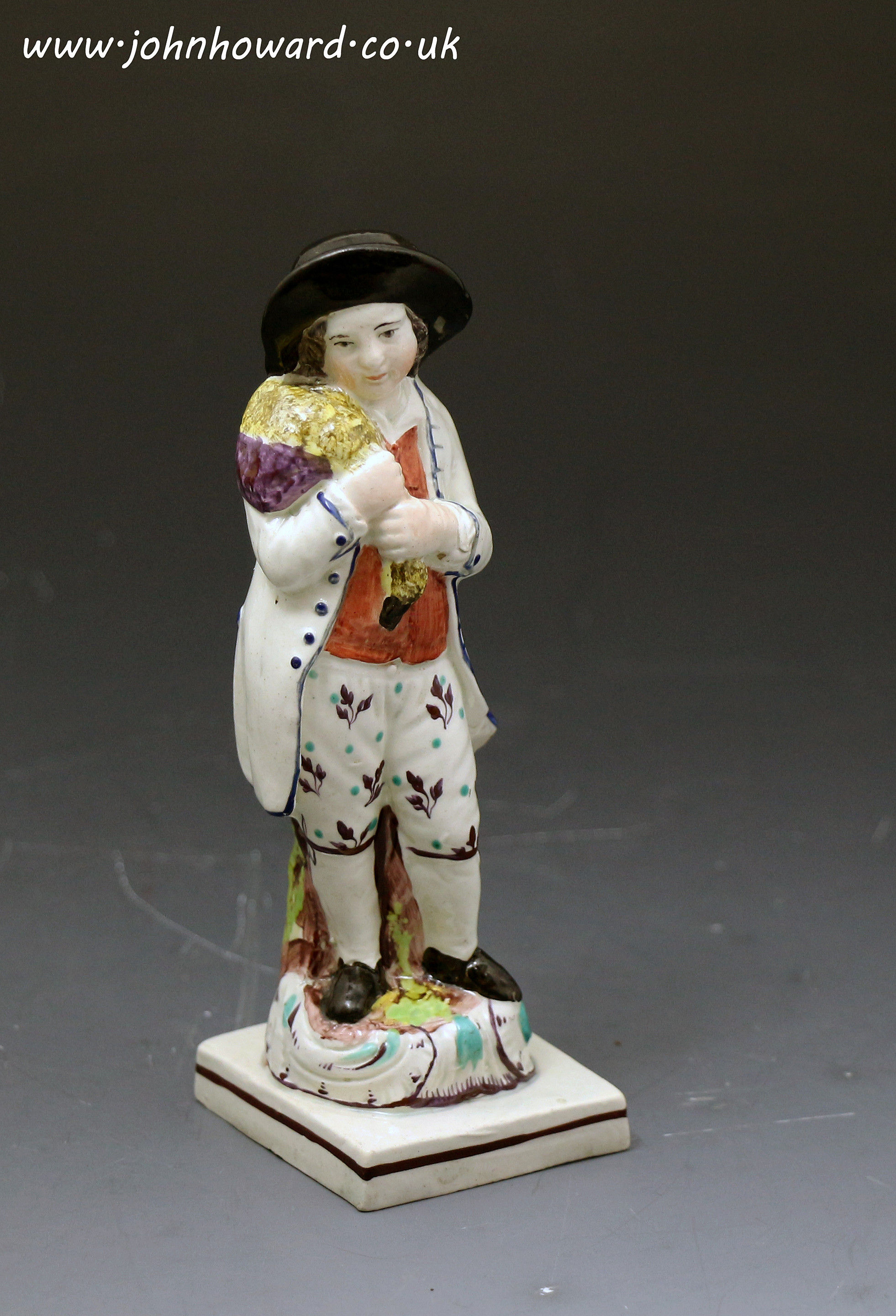 Antique Staffordshire pottery figure of a boy with a goose late 18th century