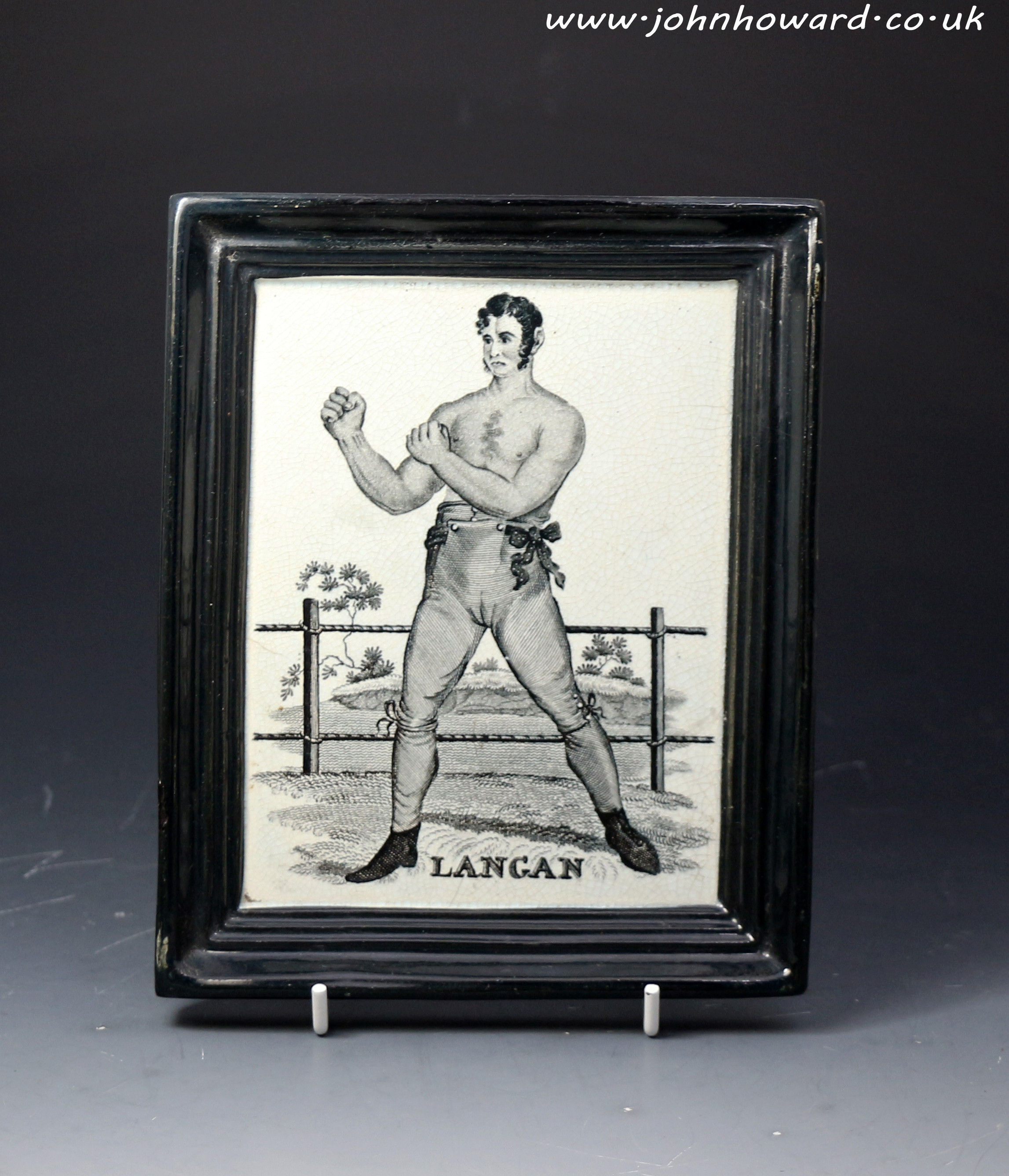 Antique English pottery plaque portraying the figure of Langan the Irish boxer