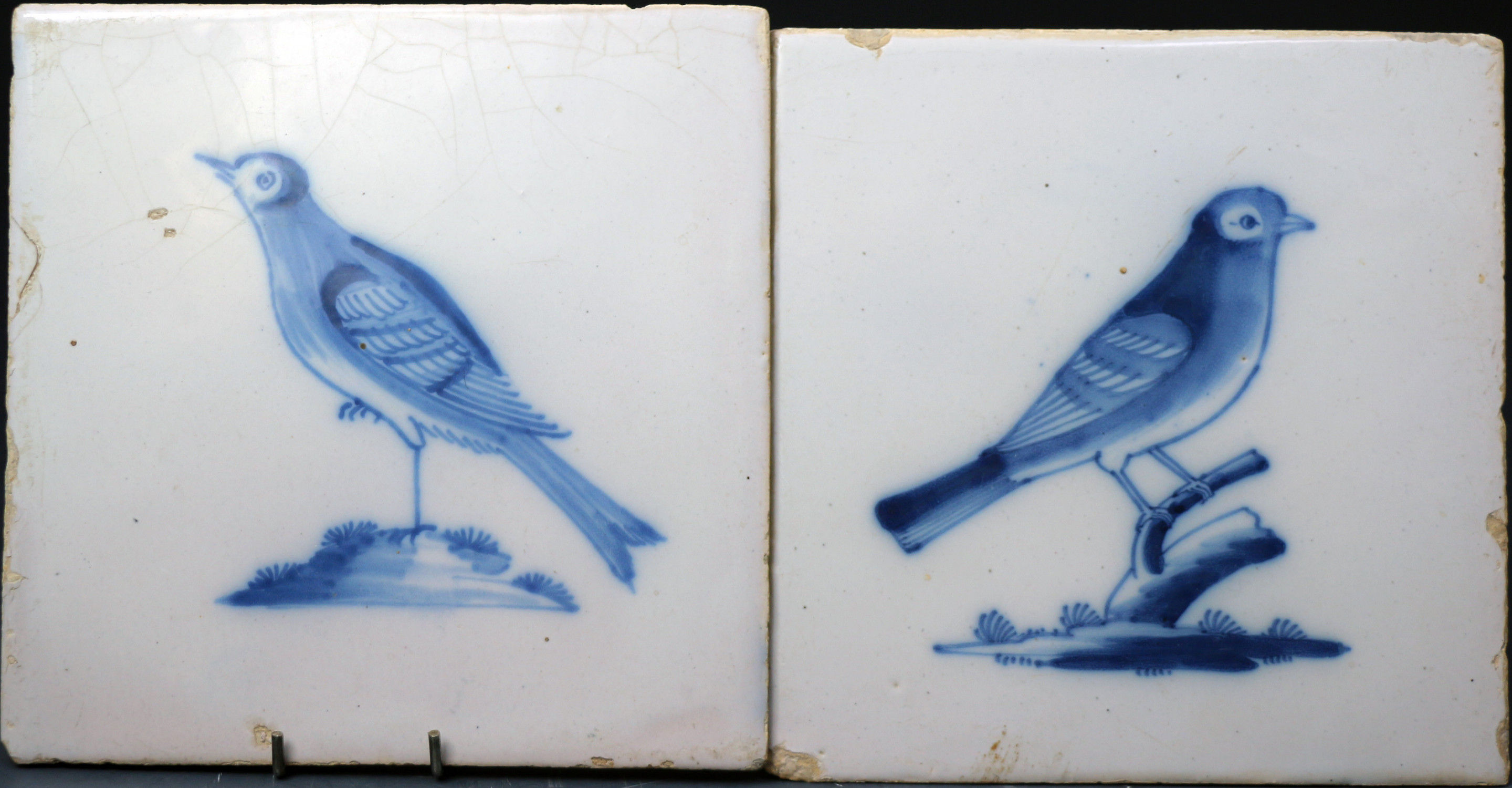 English delftware earthenware tiles with each decorated with a bird in cobalt blue. c1750