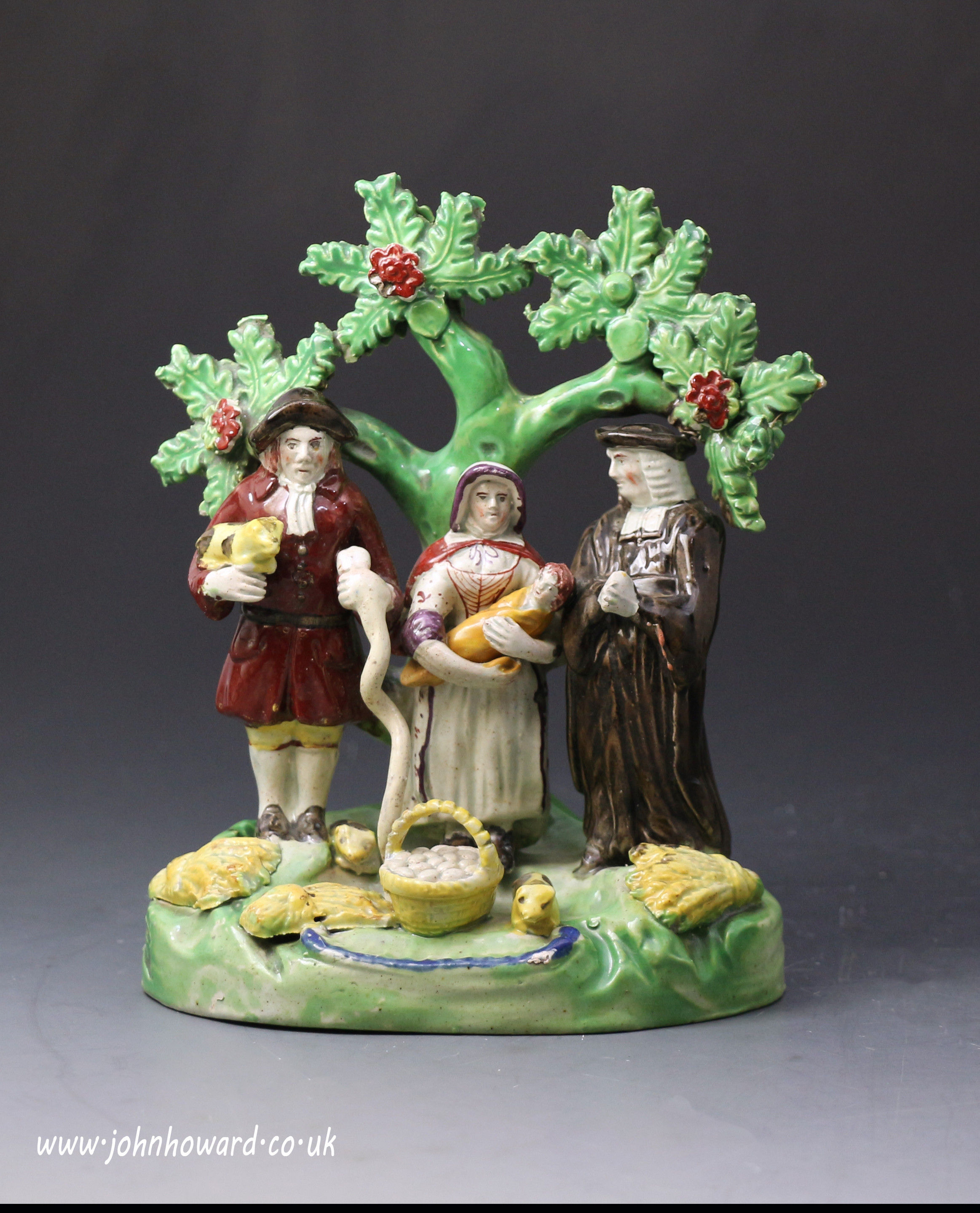 Staffordshire pottery pearlware figure group PIG TITHE early 19th century.