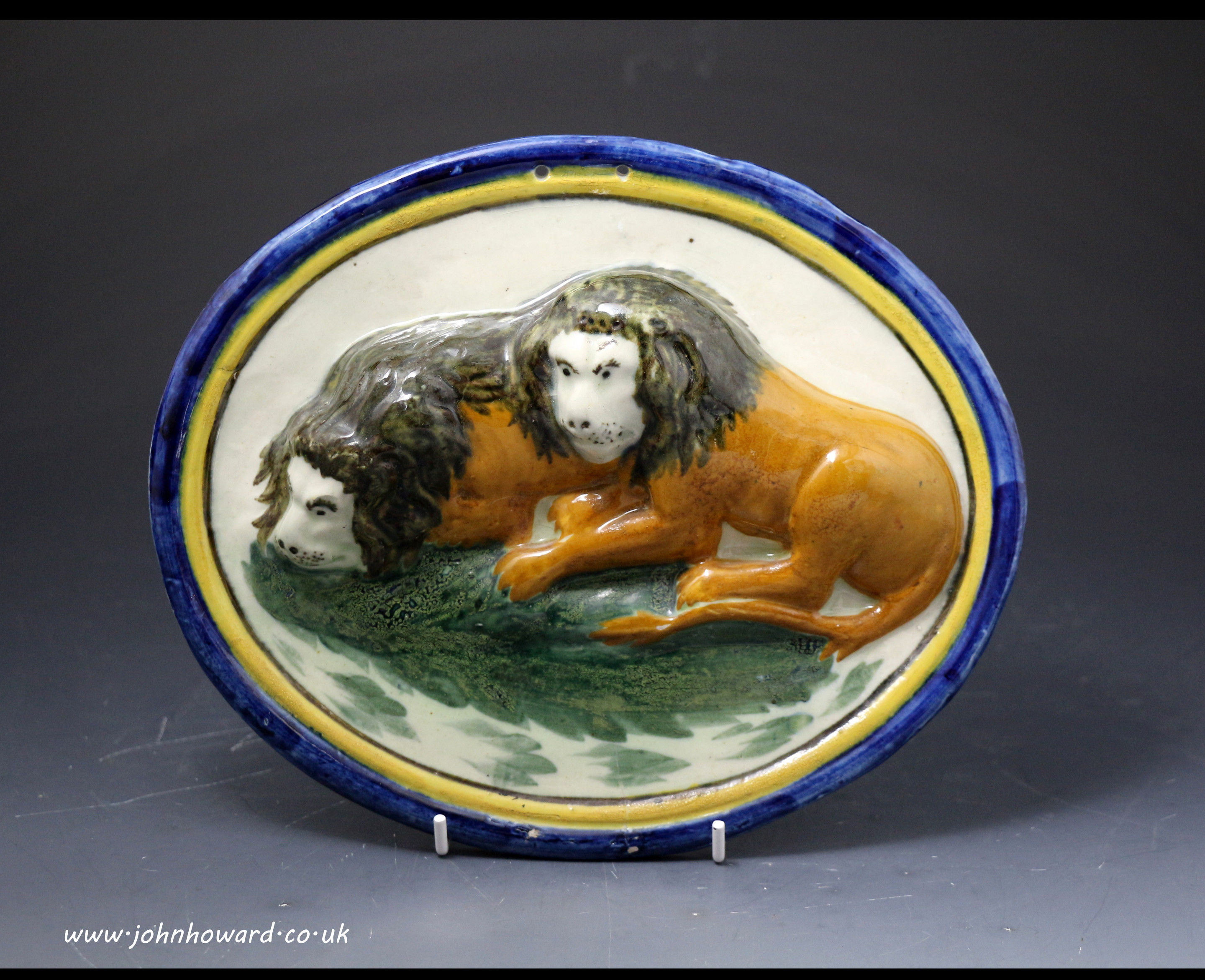English pottery plaque with figures of two lions Pratt ware antique period early 19th century