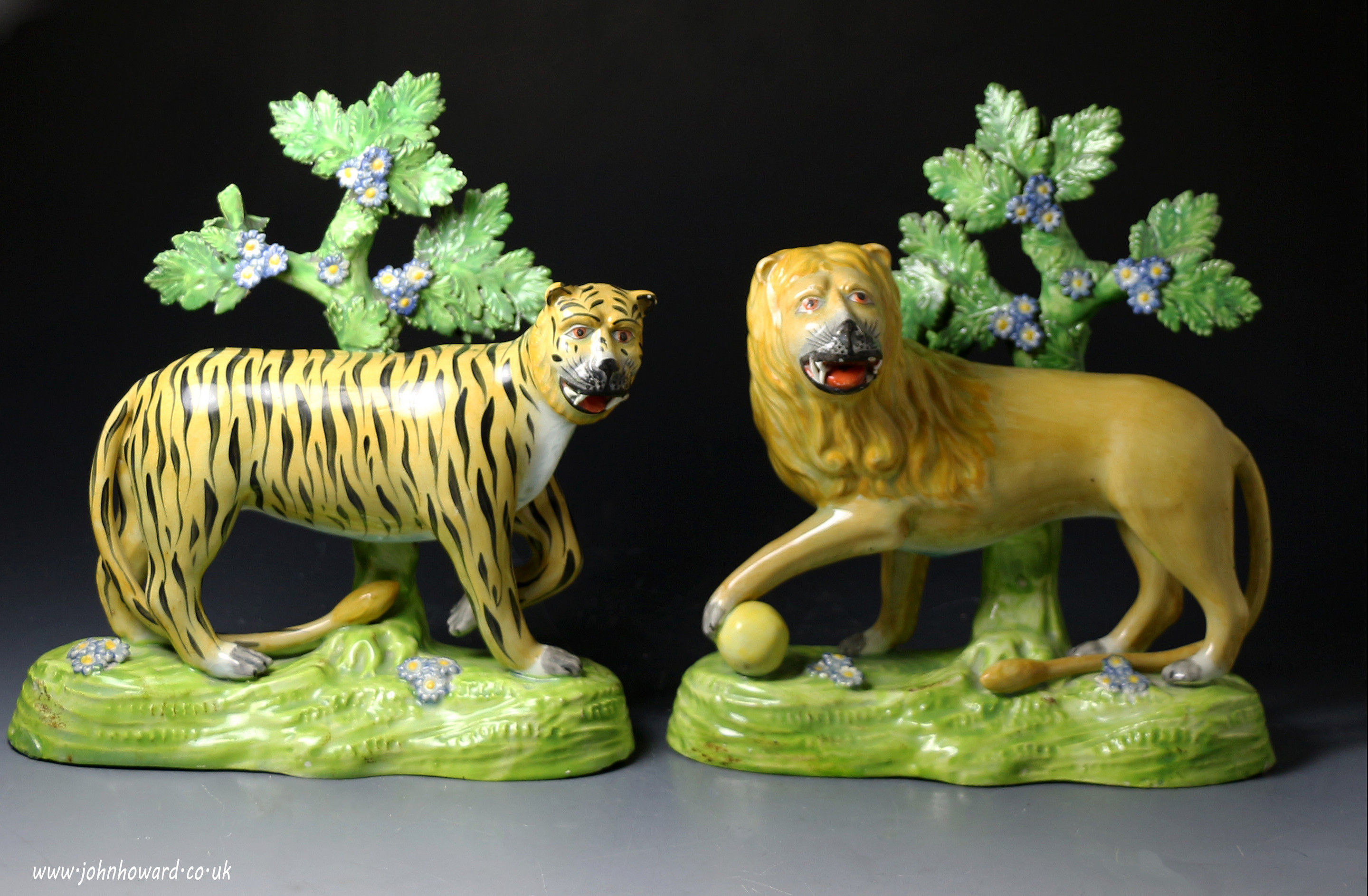 Antique Staffordshire pearlware pottery figure pair of a tiger and lion early 19thc by Dale and Co.
