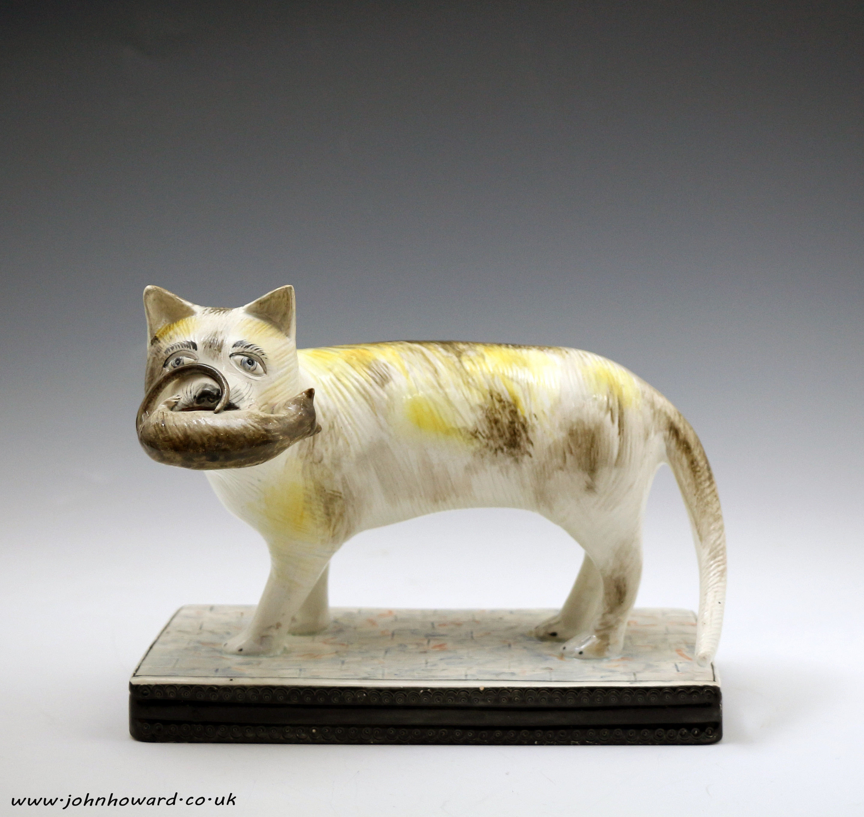 Staffordshire pottery figure of a cat with a mouse early 19th century Pearlware English