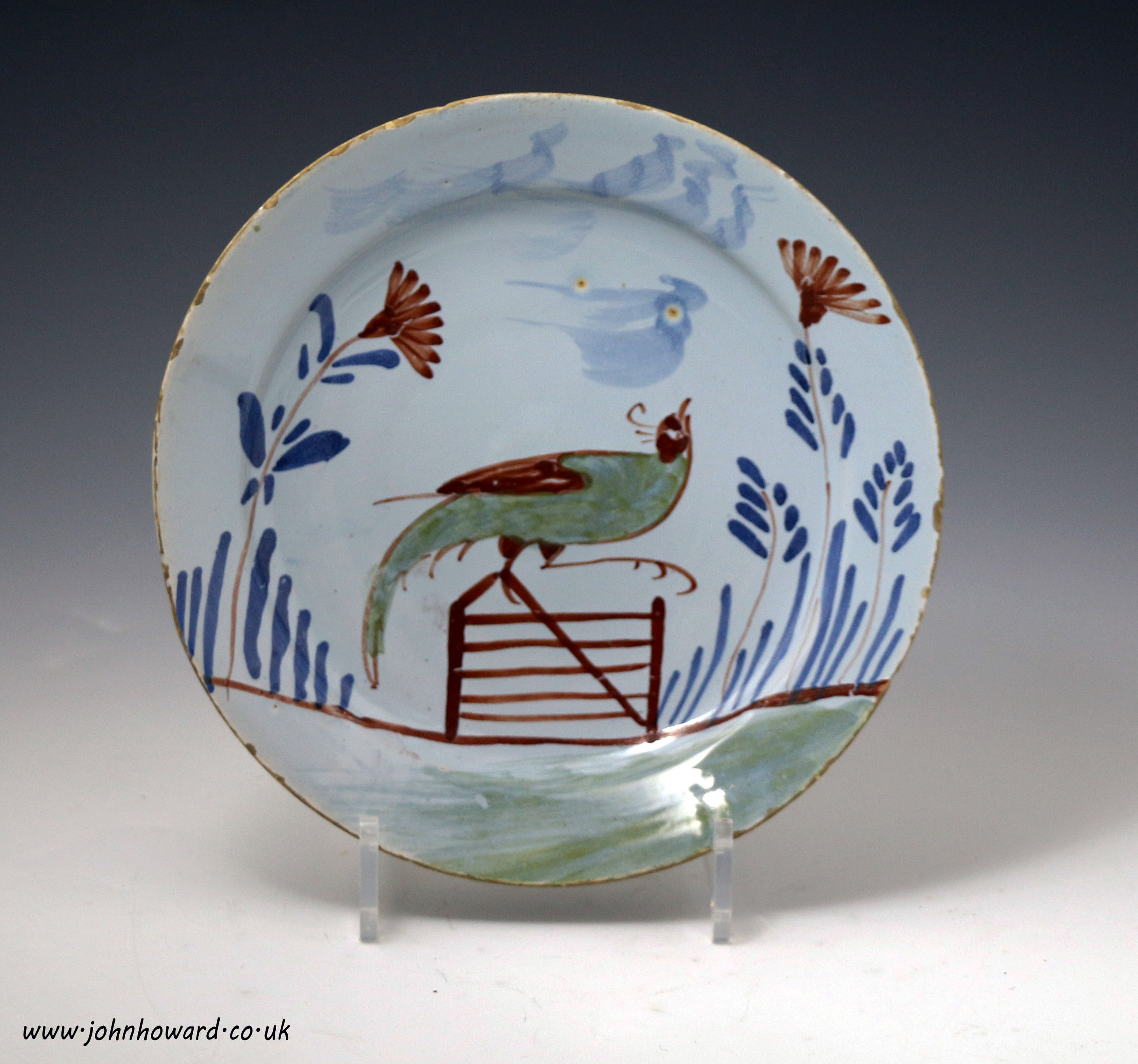 English delftware plate with pheasant perched on a gate antique period 18thc.