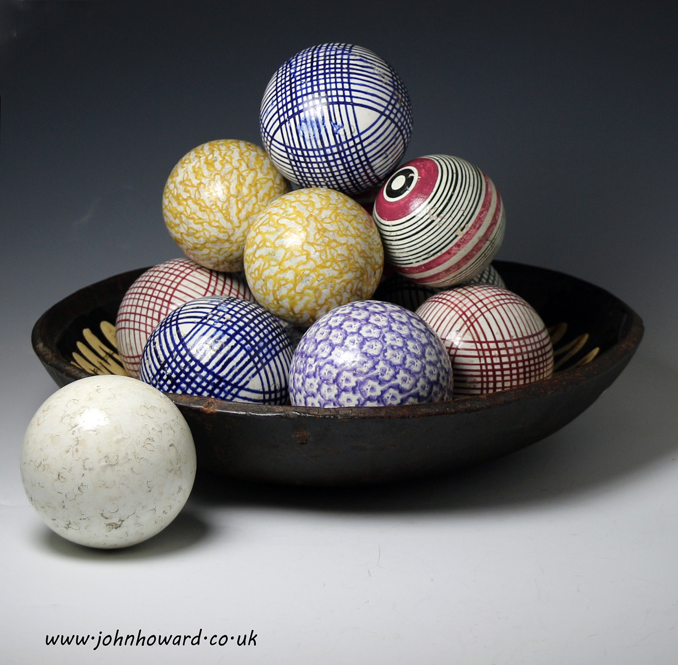 Collection of 13 pottery carpet balls mid 19th century Scottish or NE English production.