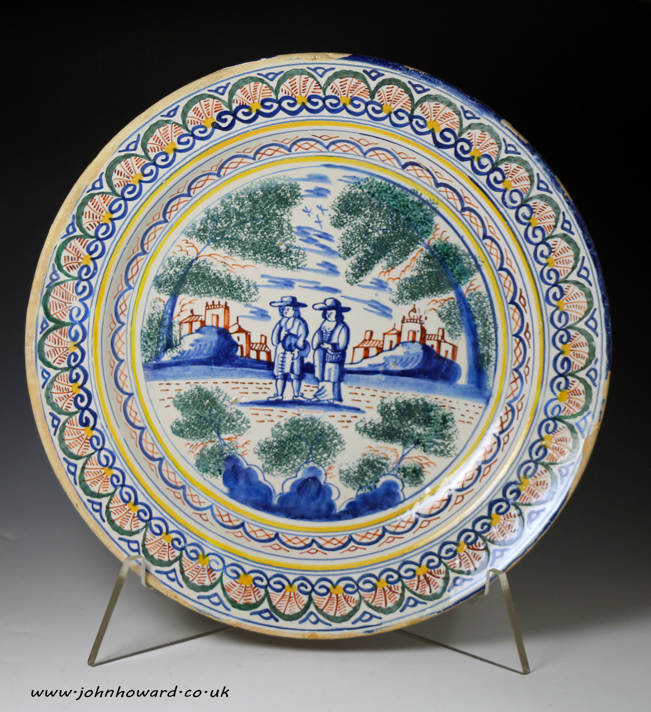 English delftware charger  with  a rural scene in polychrome colours early 18thc.  
