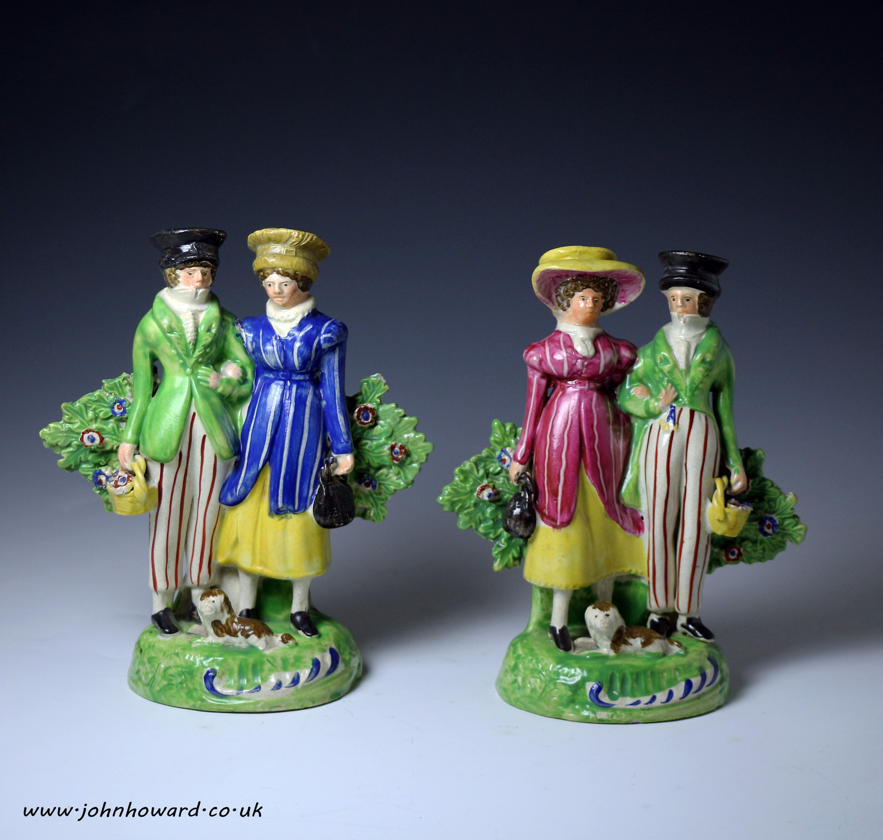 Pair of Staffordshire pottery figures of Dandies on base with bocage circa 1820 English.