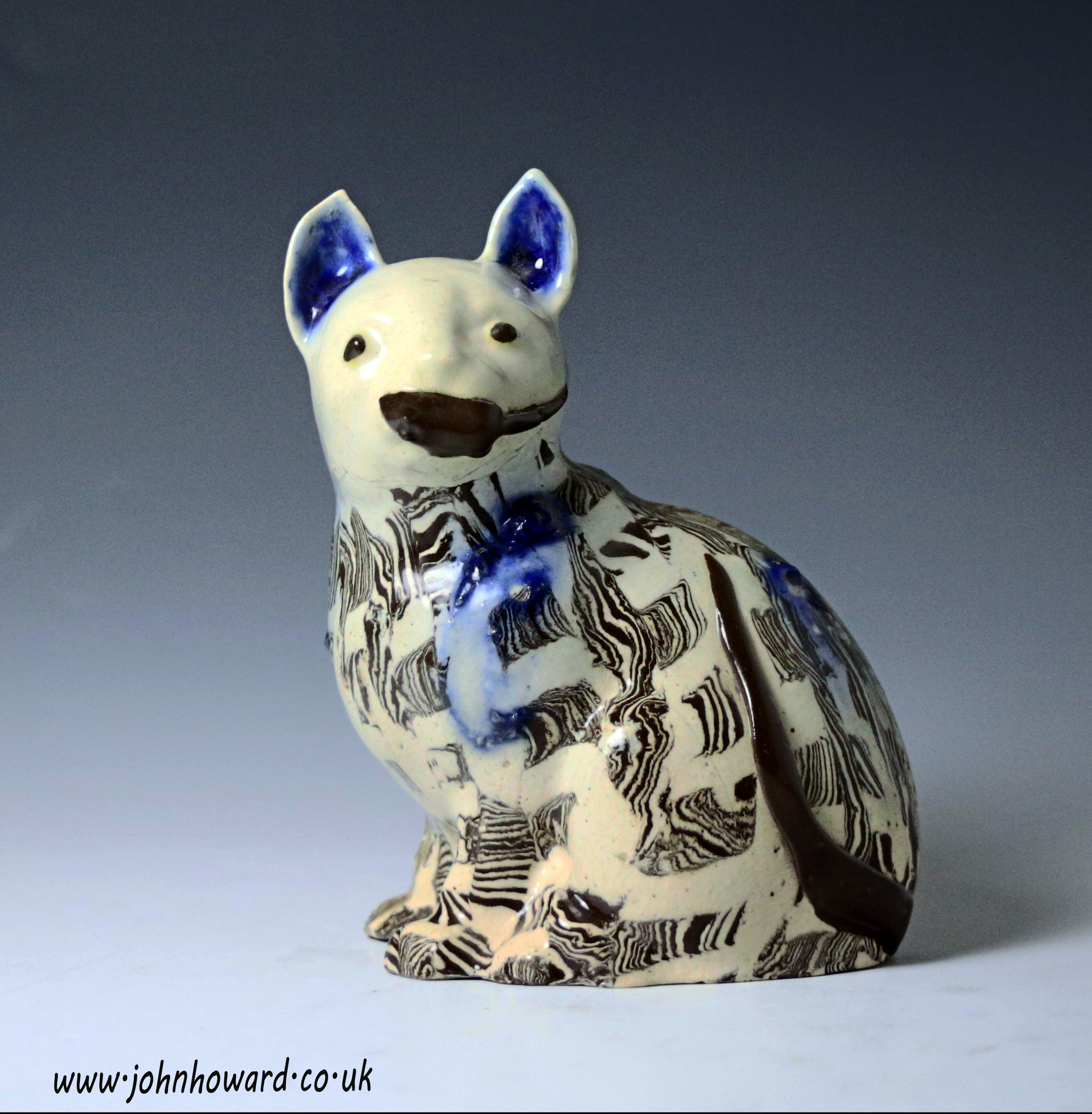 Staffordshire agateware pottery saltglaze figure of a cat mid 18th century English.