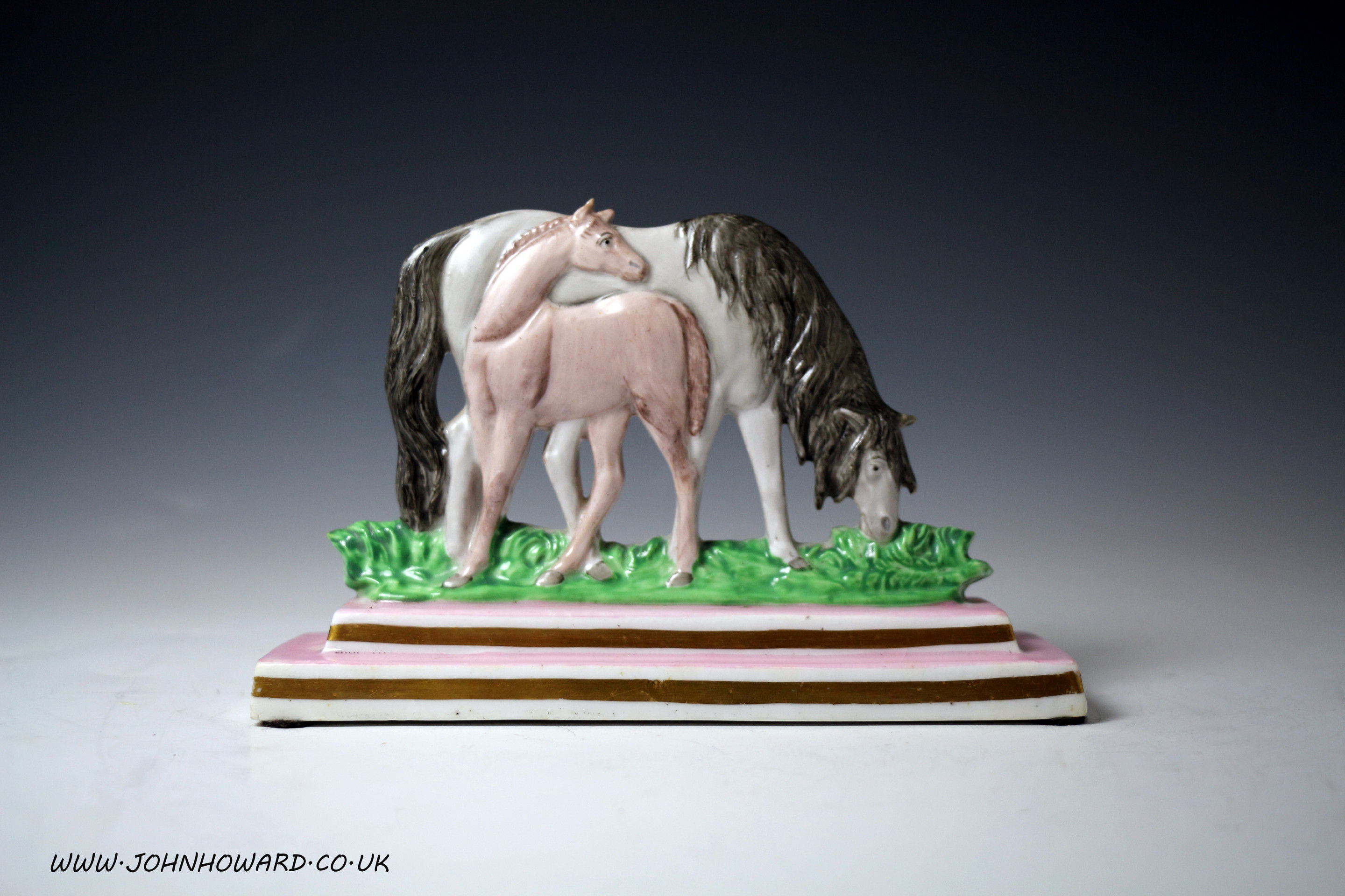 Horse and foal porcelain figure group on stepped base attributed to Swansea Wales.