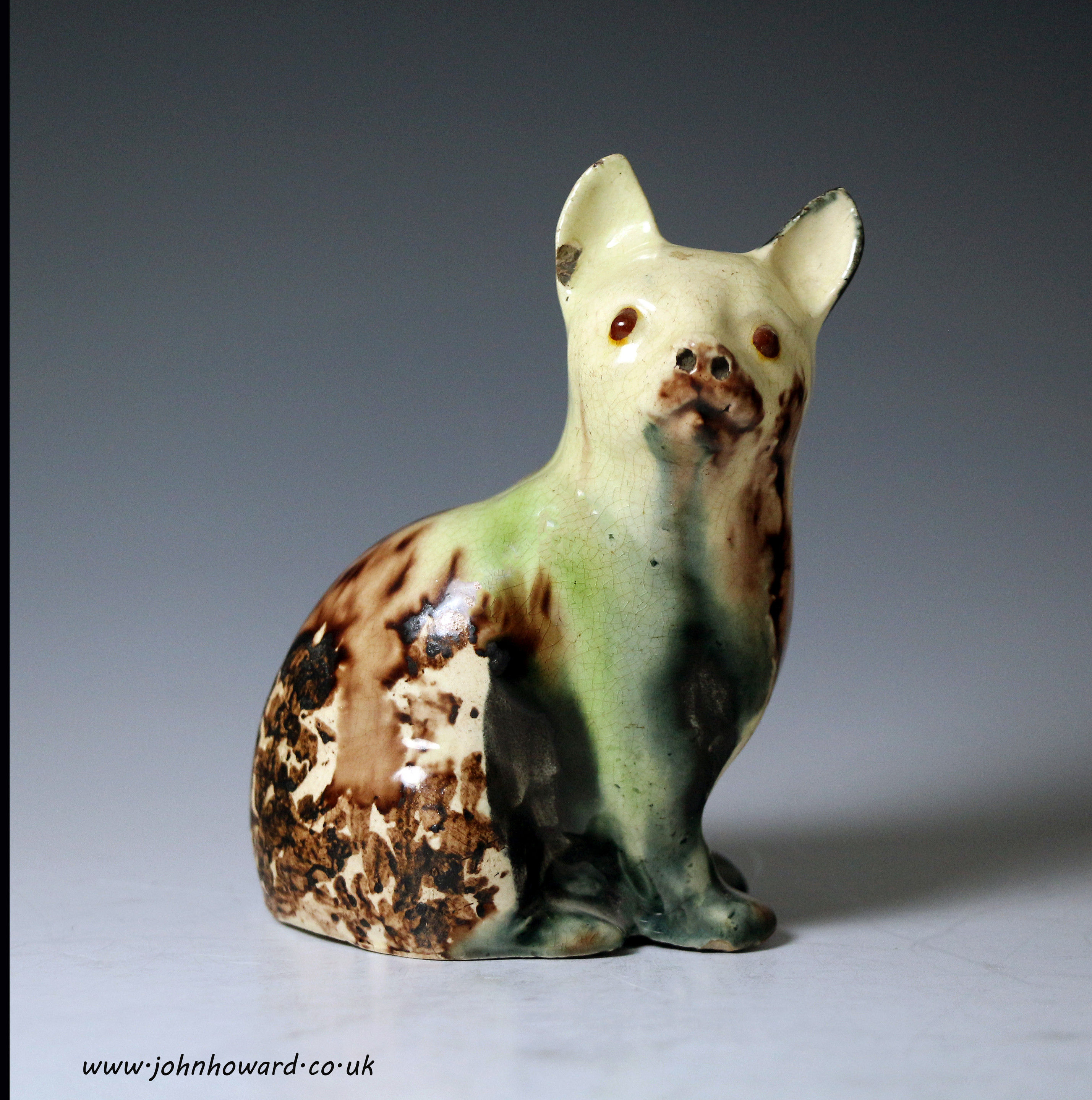 Staffordshire pottery Whieldon type creamware figure a cat in coloured glazes circa 1770