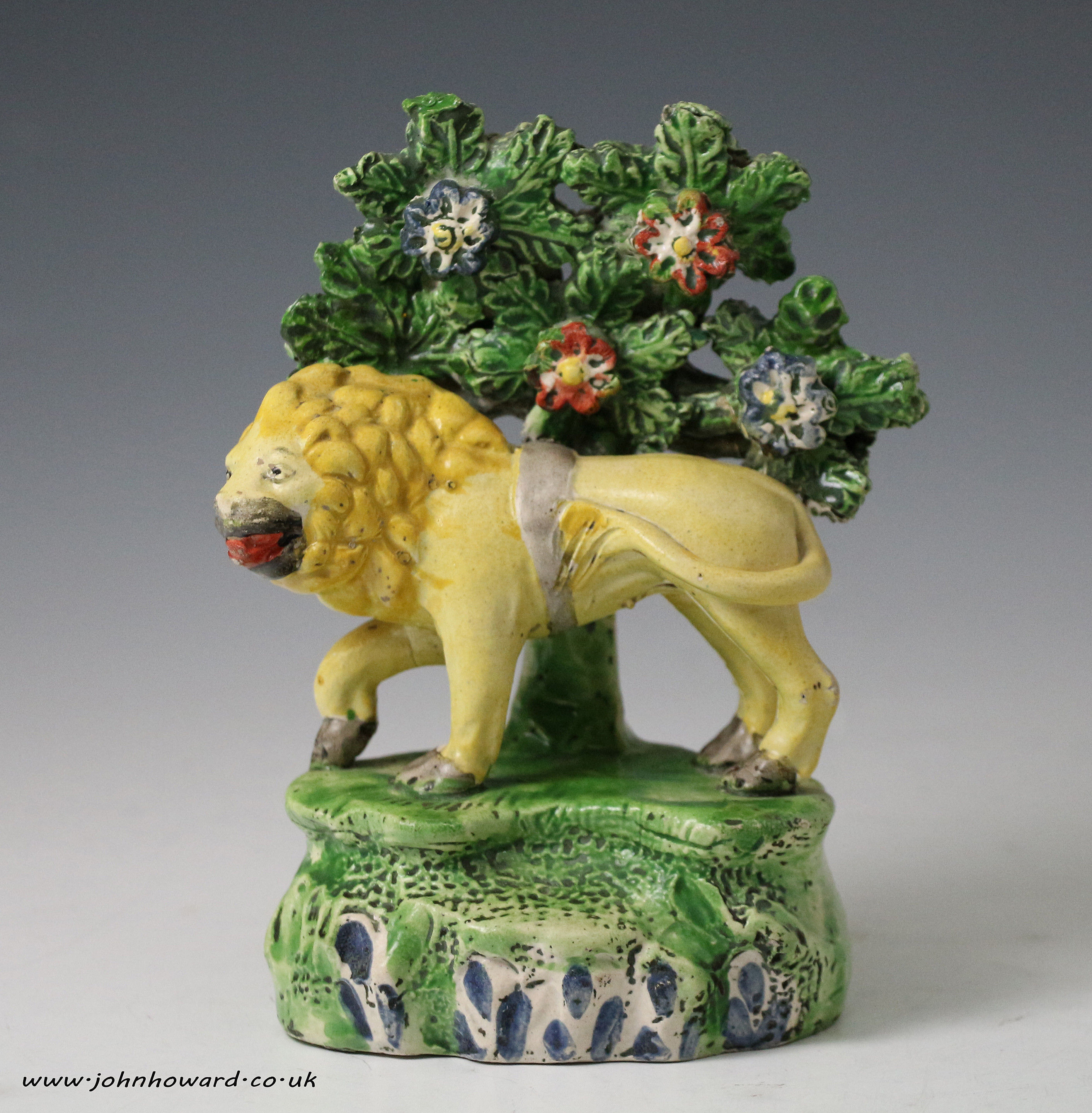 English Staffordshire pottery pearlware bocage figure of a lion early 19th century