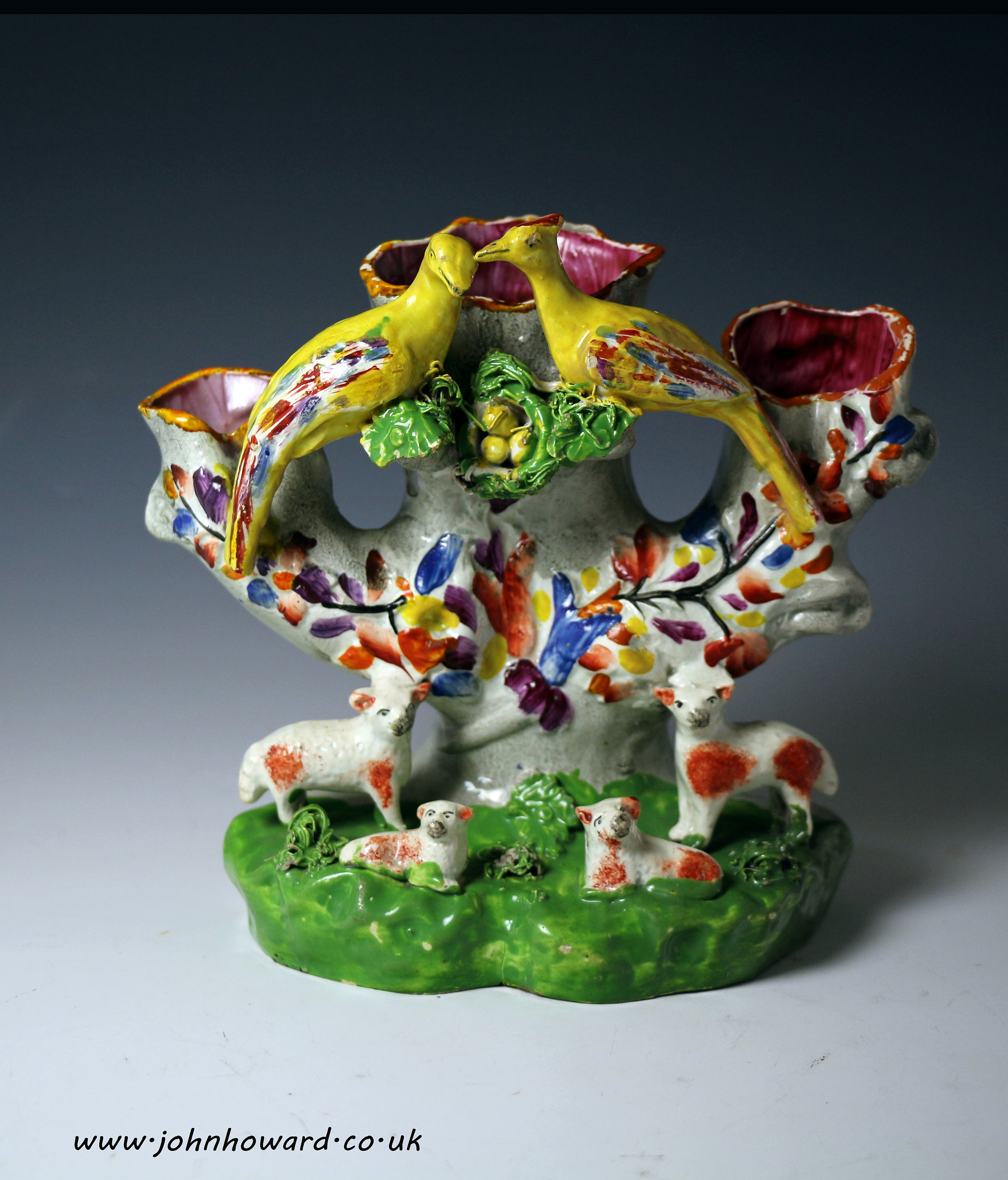 Antique Staffordshire pearlware pottery of sheep and peafowl figure group.circa 1825