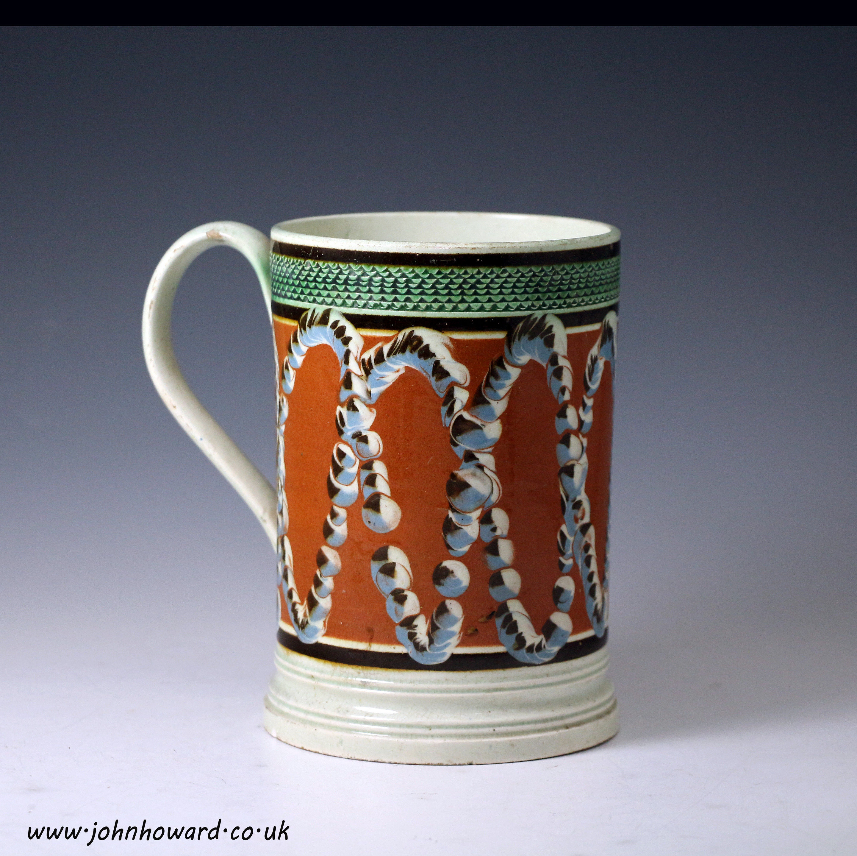 Antique English pottery early mochaware tankard with earth worm patterns early 19th c.
