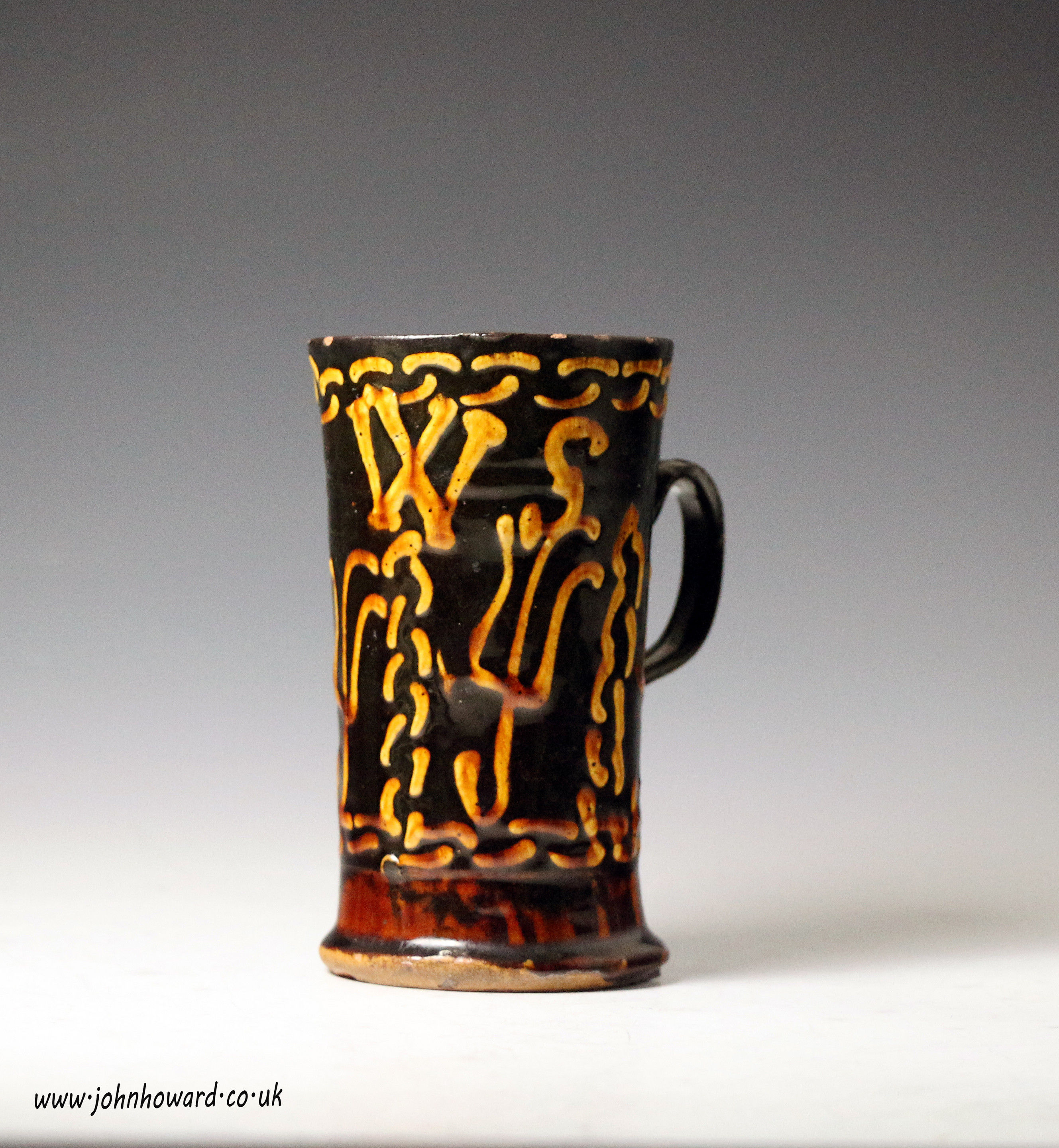 Early 18th century English slipware tankard with frog c1720 period.