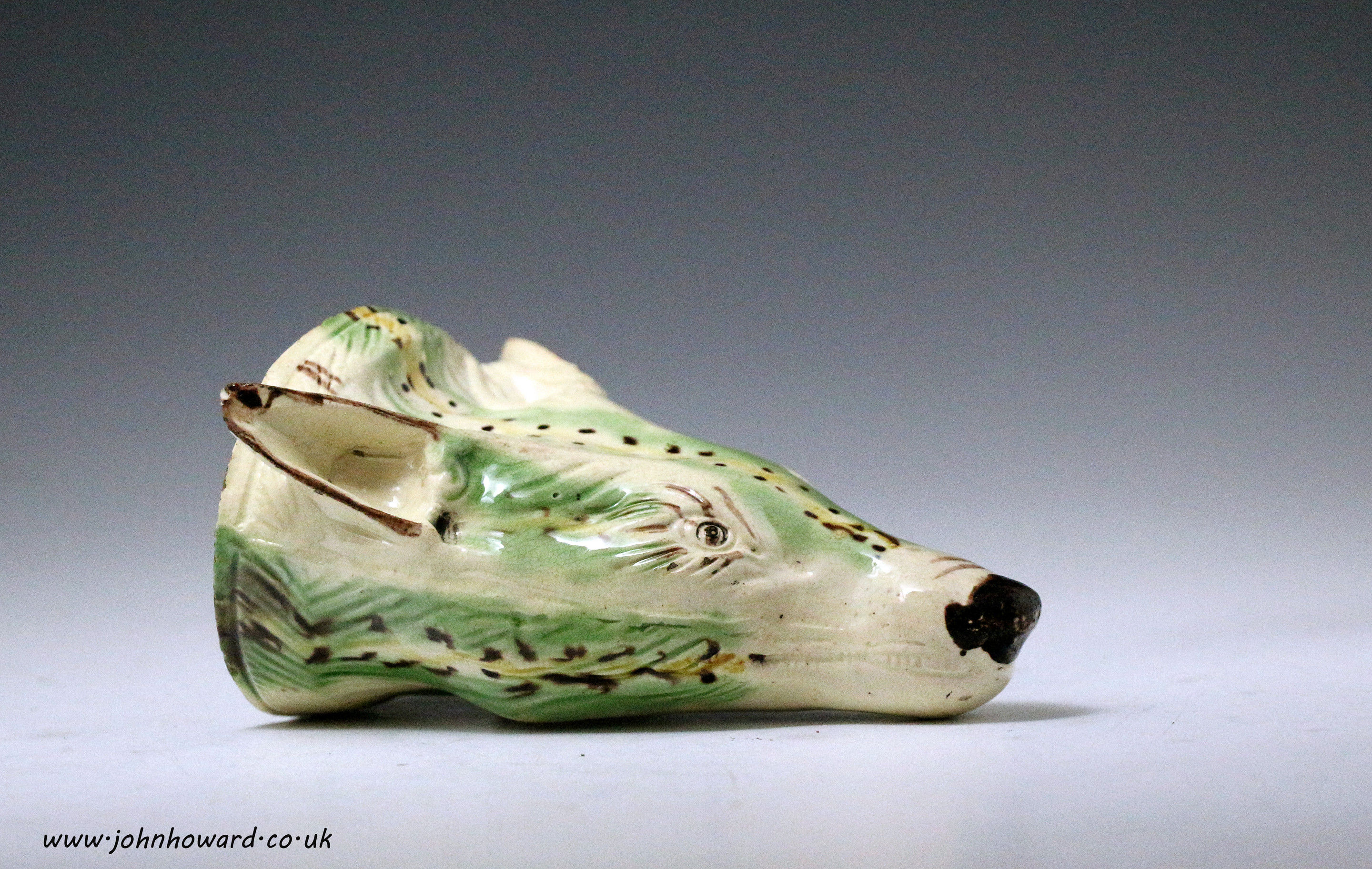 Creamware body pottery fox head stirrup cup. circa 1780 antique period England.