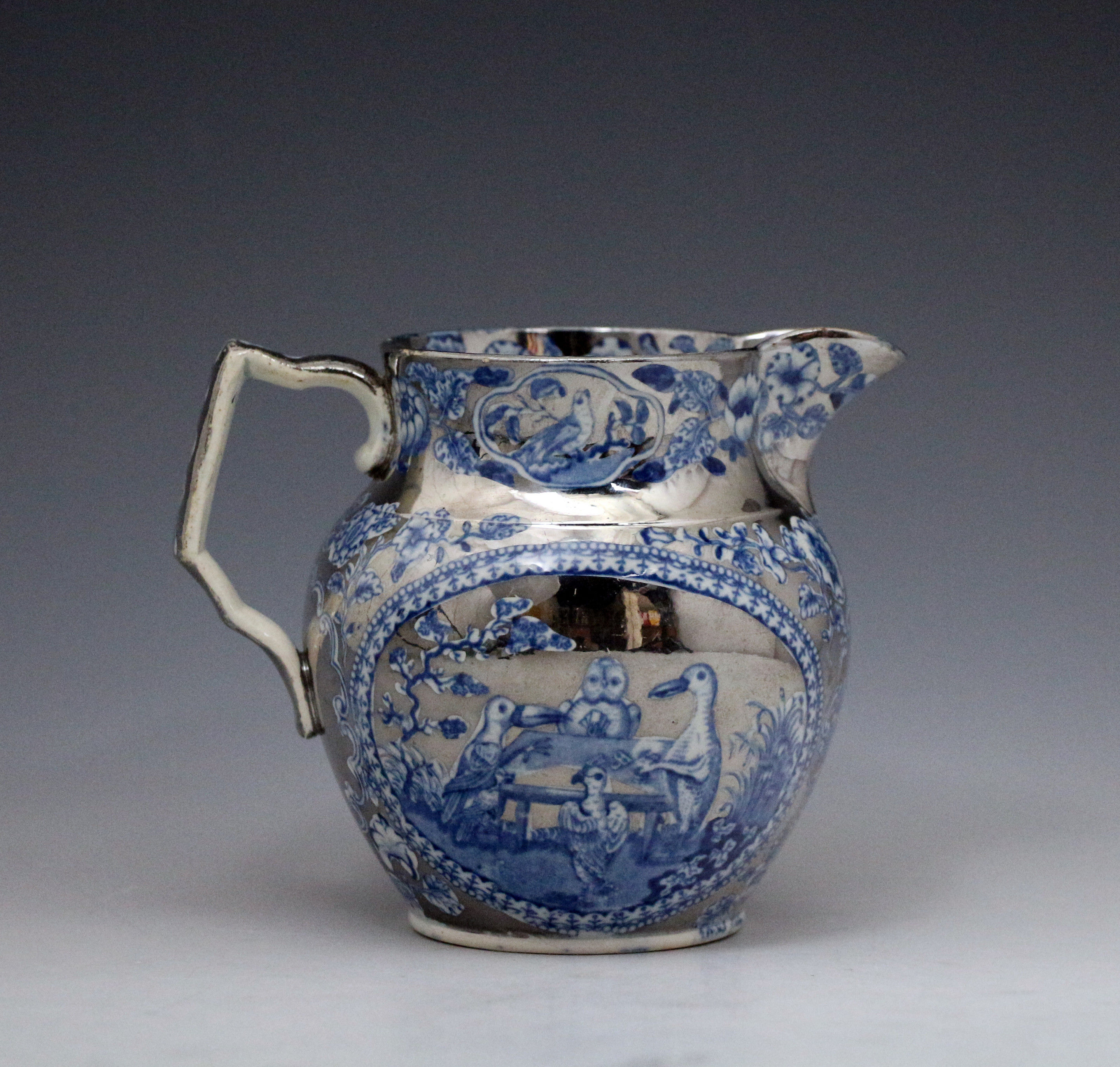 Silver luster and blue enamel decorated pitcher English early 19th century