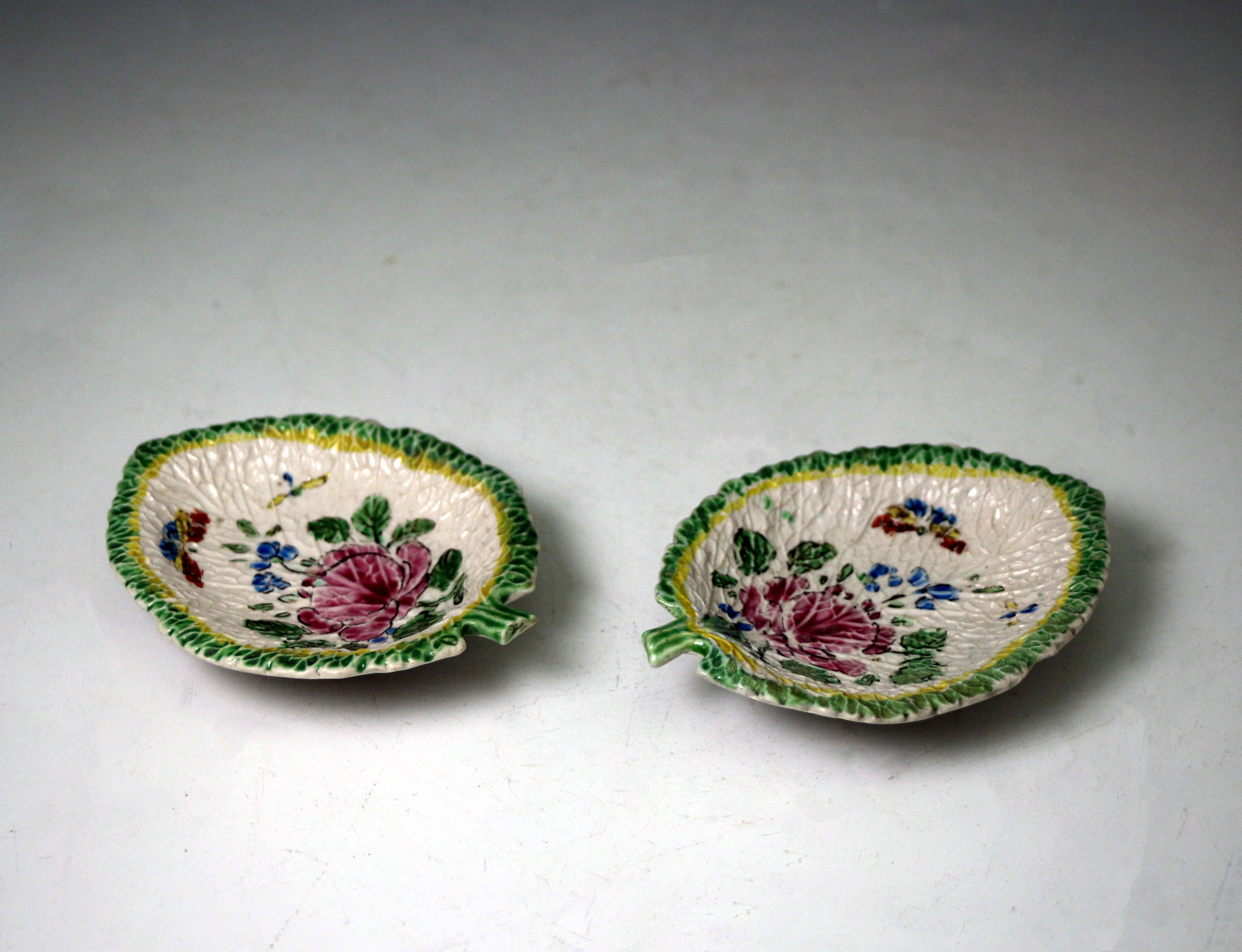 Pair of Staffordshire pottery saltglaze stoneware leaf shaped dishes with enamels circa 1760